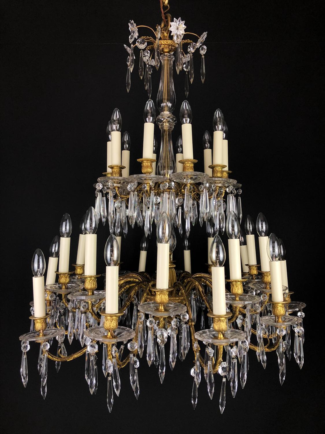 A thirty light Baccarat crystal chandelier with two tiers. The top tier with 10 lights and the bottom tier made up of 20 lights, alternating in height.

circa 1860 to 1870Dimensions:
W: 90cm (35.4
