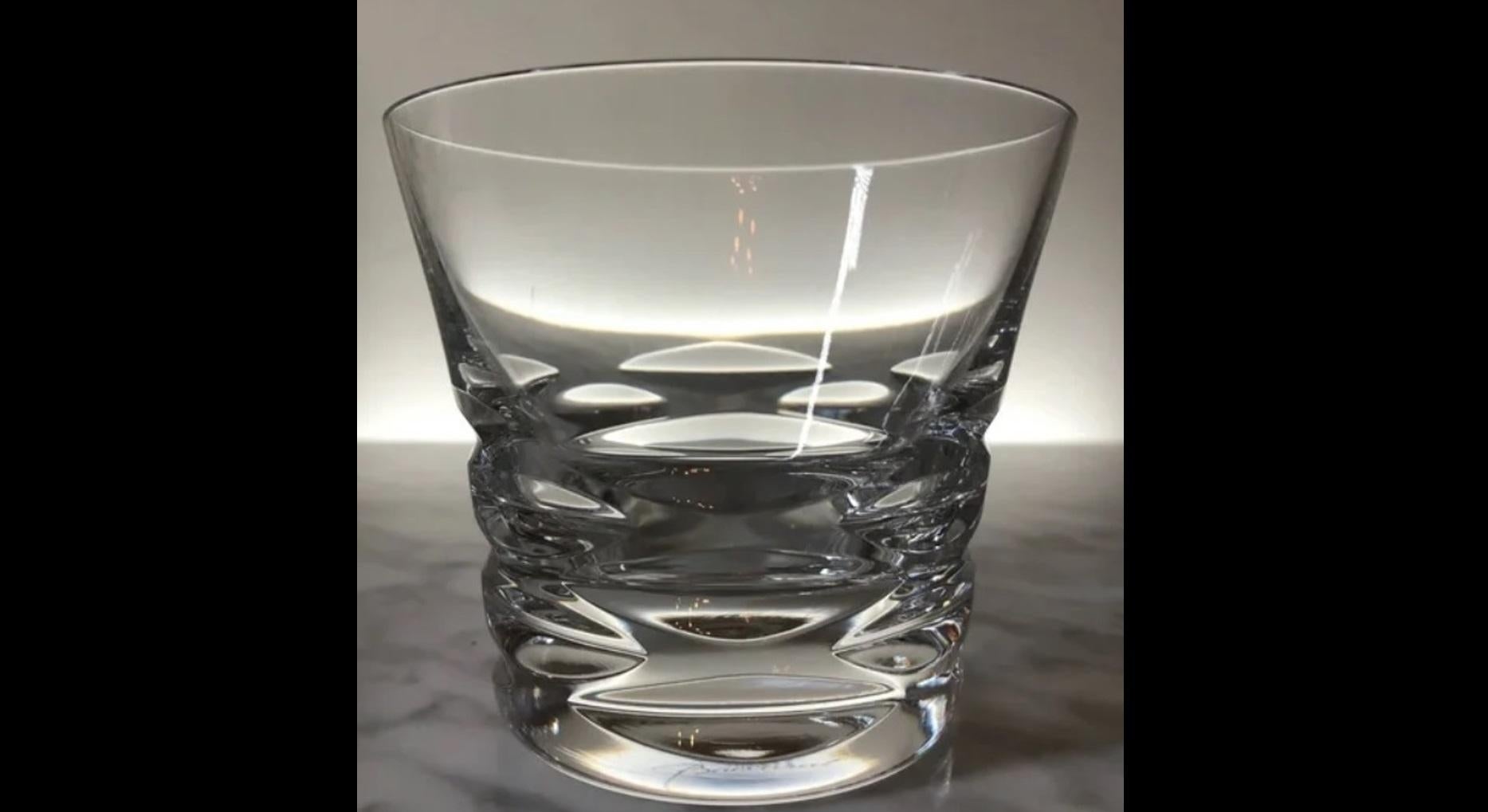 Beauty, craftsmanship and design all collide in this fabulous set of crystal glasses.  This set of 4 glasses by Baccarat exemplifies the dedication and style that the French maker is known for.  Pure, glistening, flawless crystal swirls within these