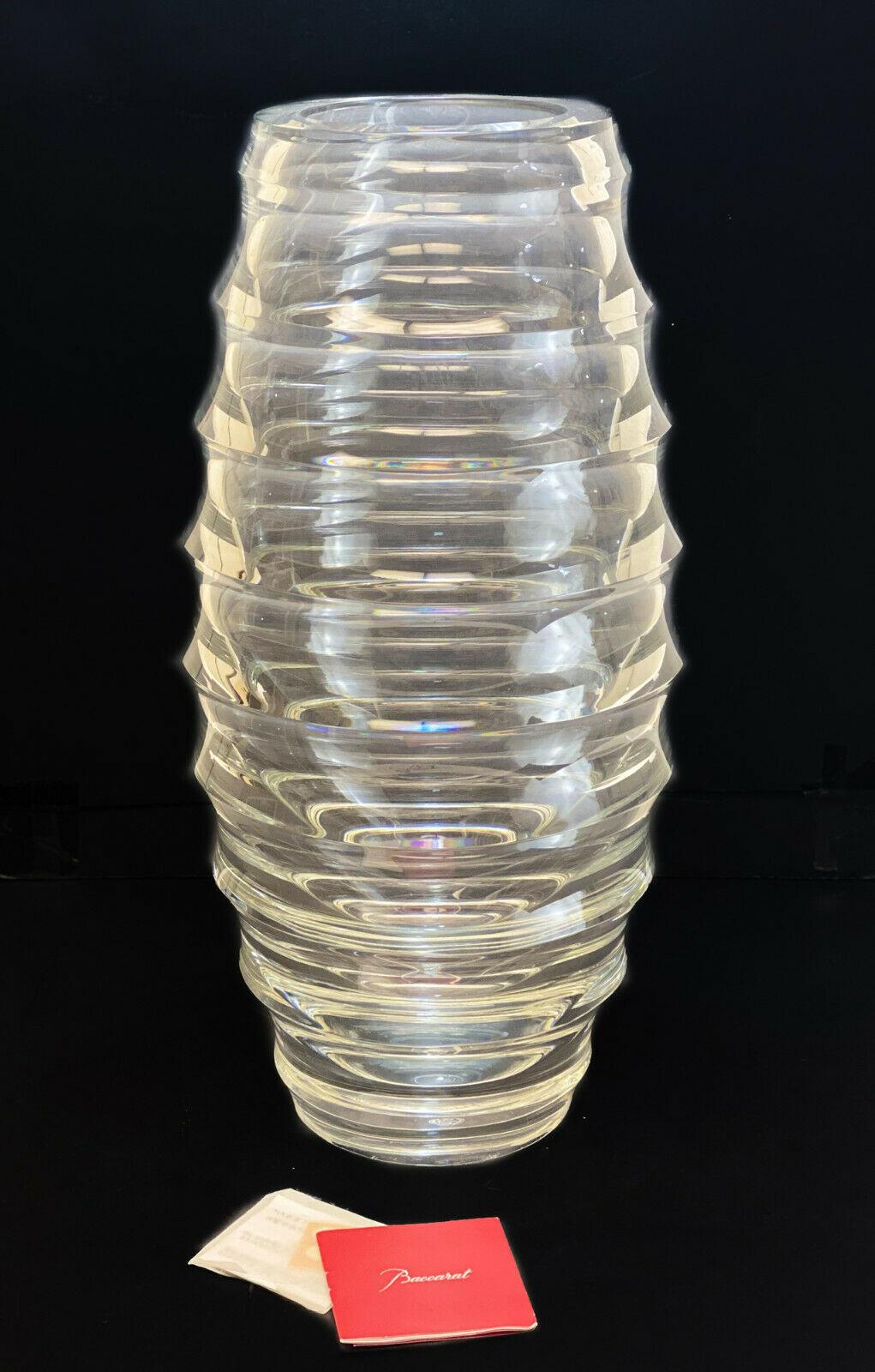 Baccarat crystal glass circumference vase by Vicente Wolf. Hive form. Signed Baccarat towards the base and an acid etched Baccarat stamp to the underside. In original box.

Weight approx., 20 lbs

Measures: Approx., vase: 8.75 inches diameter x