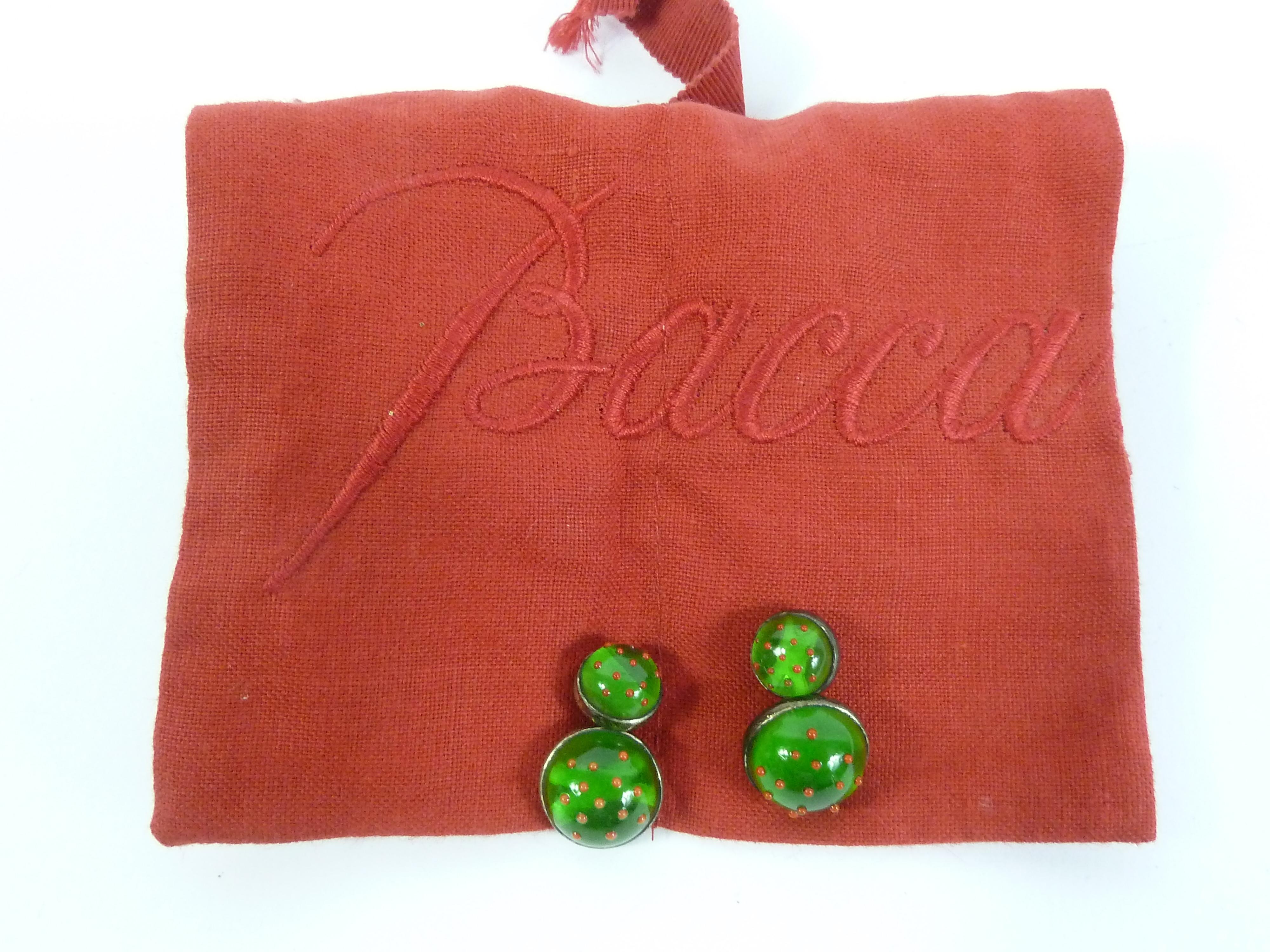 Baccarat vintage 90s cufflinks. Men's crystal cufflinks with silver colored base. Green color with red decoration, which depicts a ladybug. Made in Italy. Excellent vintage condition. Original fabric case.

Large diameter: 1.5cm
Small diameter: 1 cm