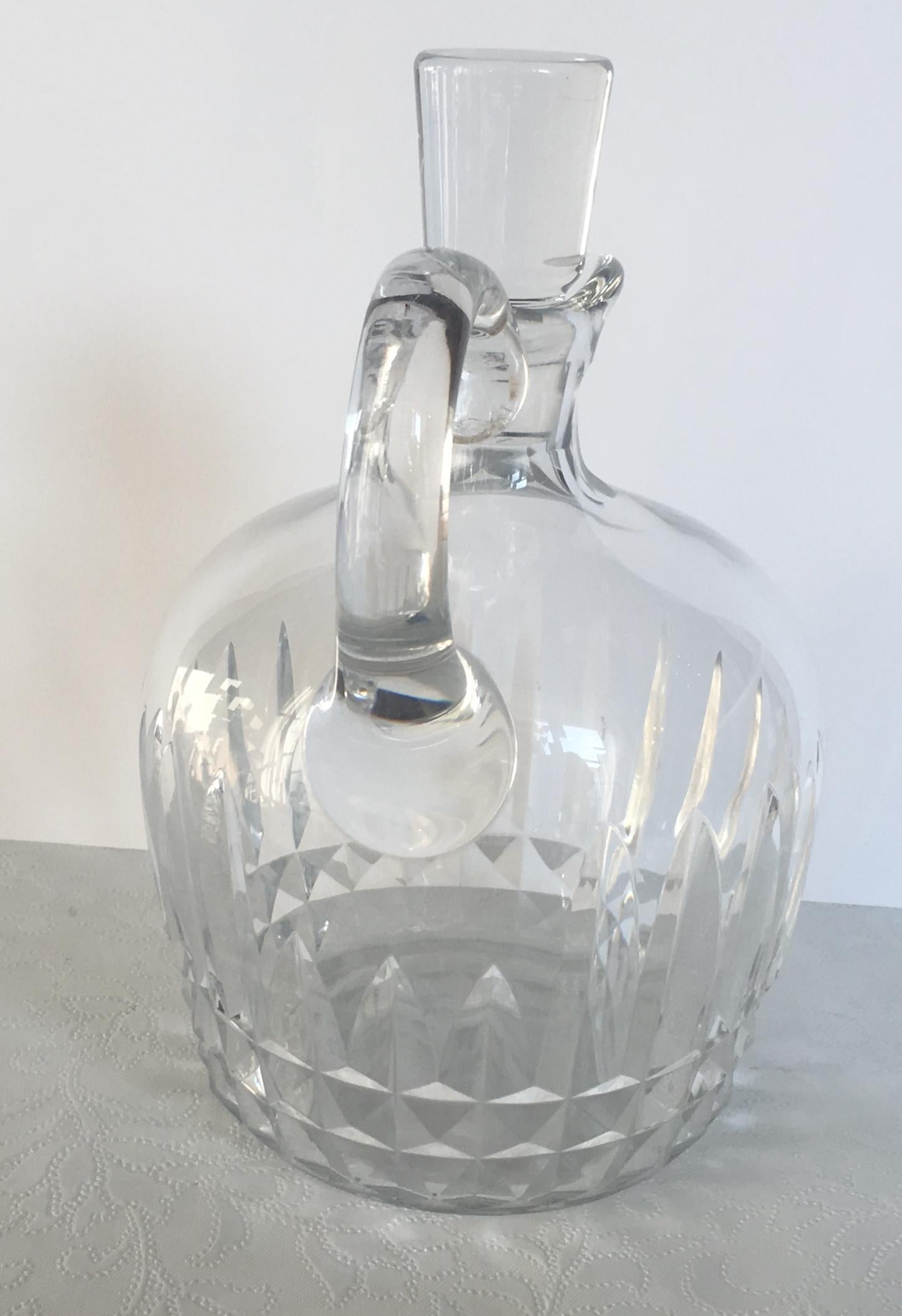Elegant Baccarat handcut crystal decanter and original bouchon (cork) in what seems to be unused condition.
 
Excellent quality, circa 1950. 
Bears the makers mark.
A new bouchon has been sourced as the original has a minor imperfection on the outer