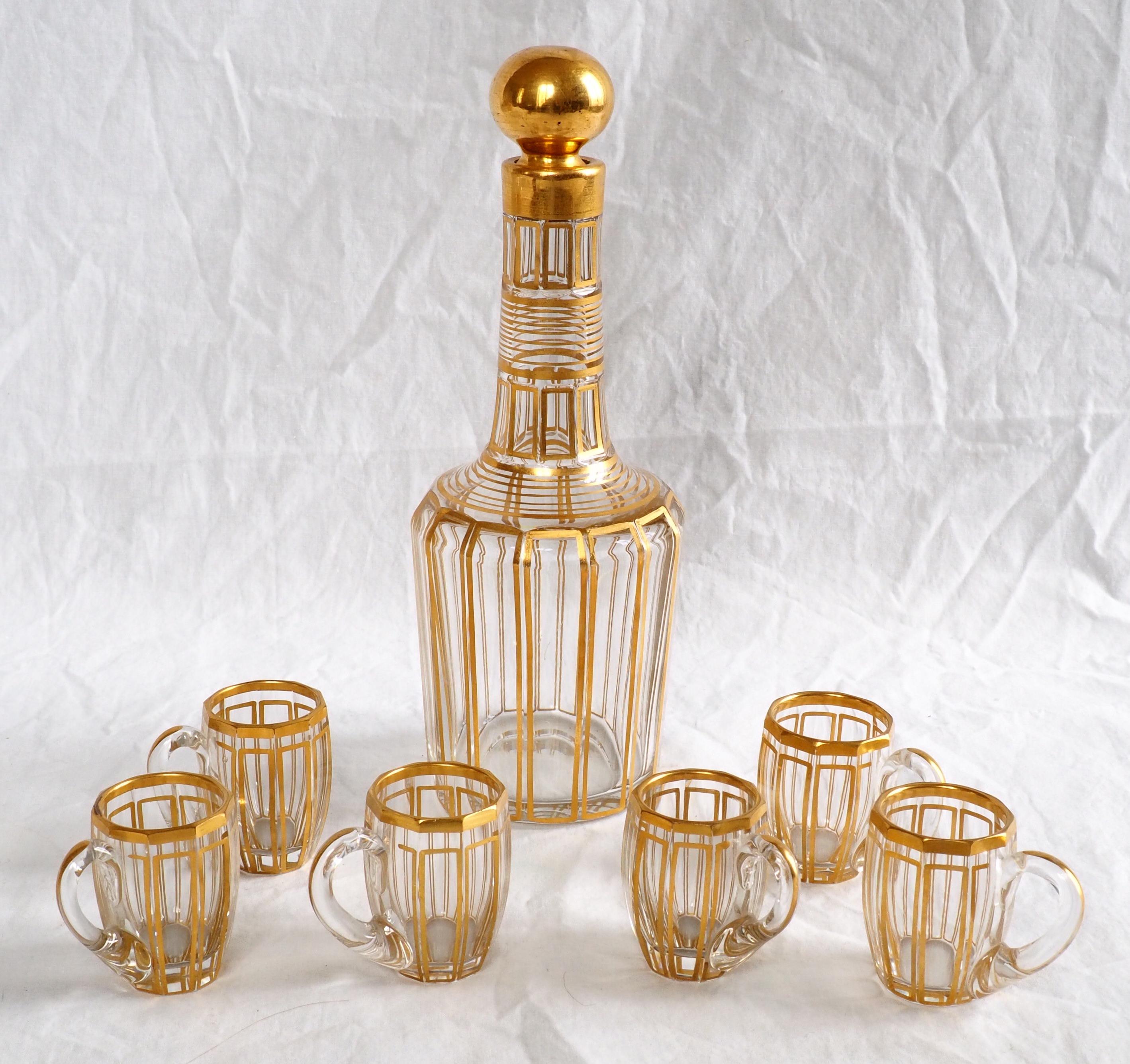 Stunning French antique Baccarat crystal liquor set for 6 guests composed of 1 bottle and 6 glasses (barrel-shaped cups with a handle).
Our set is an elegant, refined Louis XVI style model listed in early 20th century tableware catalogs (1907 and