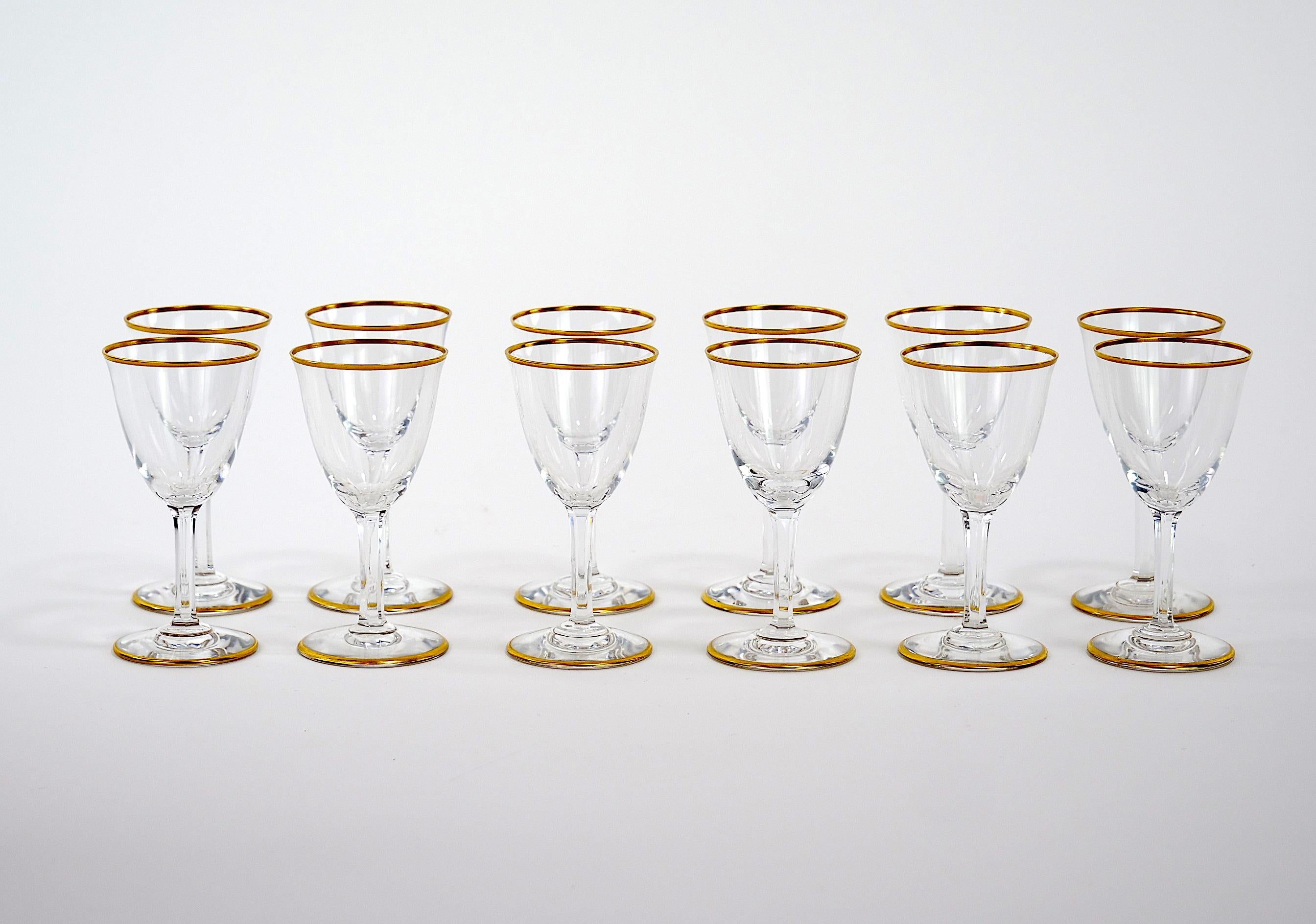 
Beautifully hand carved and gilt gold trimmed top and base baccarat crystal after dinner drinks or sherry tableware service for twelve people. Each glass is in great vintage condition. Maker's mark etched underneath. Minor wear. Each glass