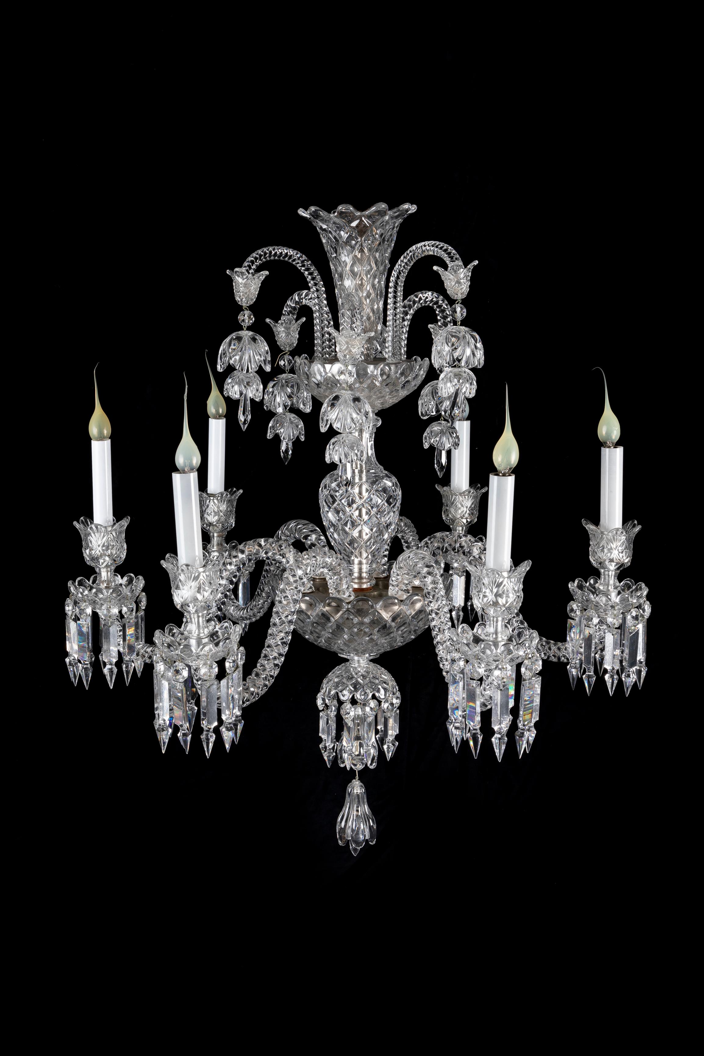 A Fine Antique French Baccarat Louis XVI Style six light crystal chandelier of exquisite craftsmanship. This unusual Baccarat crystal chandelier is constructed of six twisted crystal arms embellished with fine cut crystal prisms and further the top