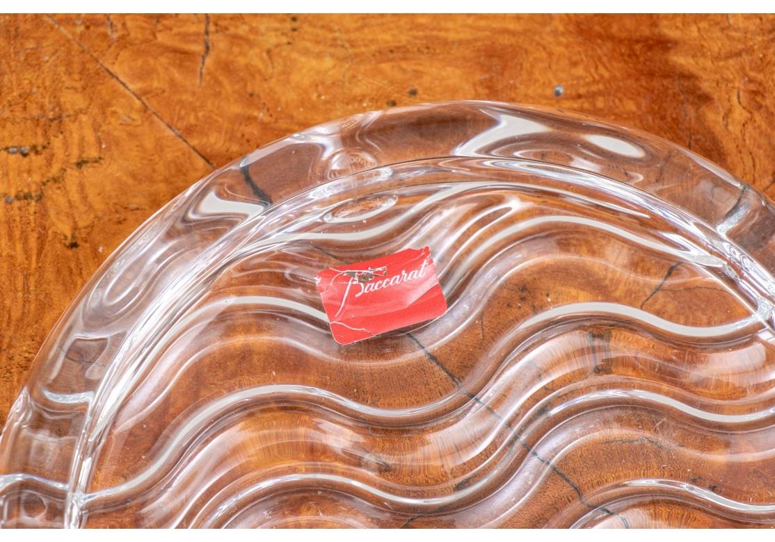 A shallow dish with wave pattern in relief. Retaining the original sticker.
Dimensions: 5