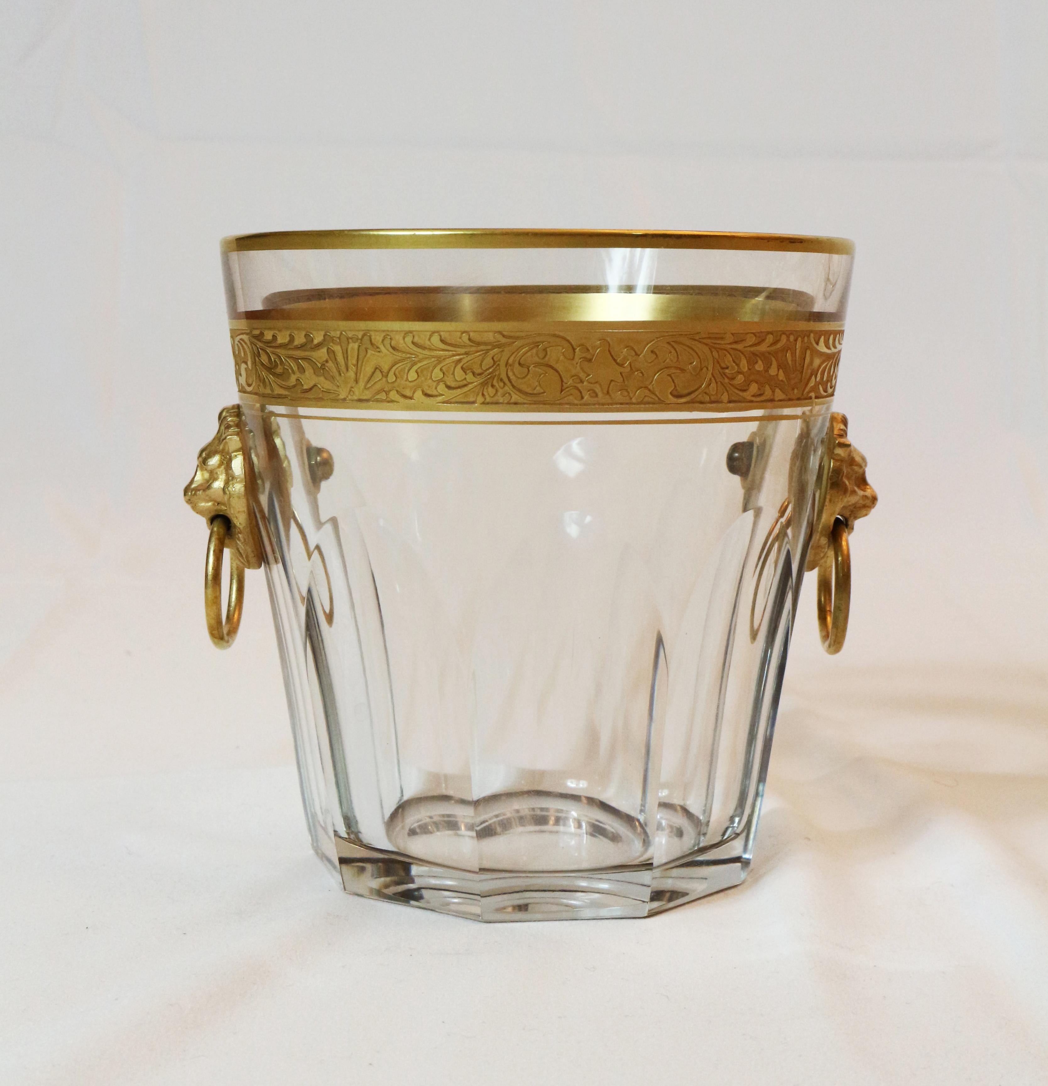 Baccarat elegant cut crystal ice bucket with  24-carat gold and bronze gilded lions, unsigned
Measures: Height 13 cm, diameter 12.5 cm.