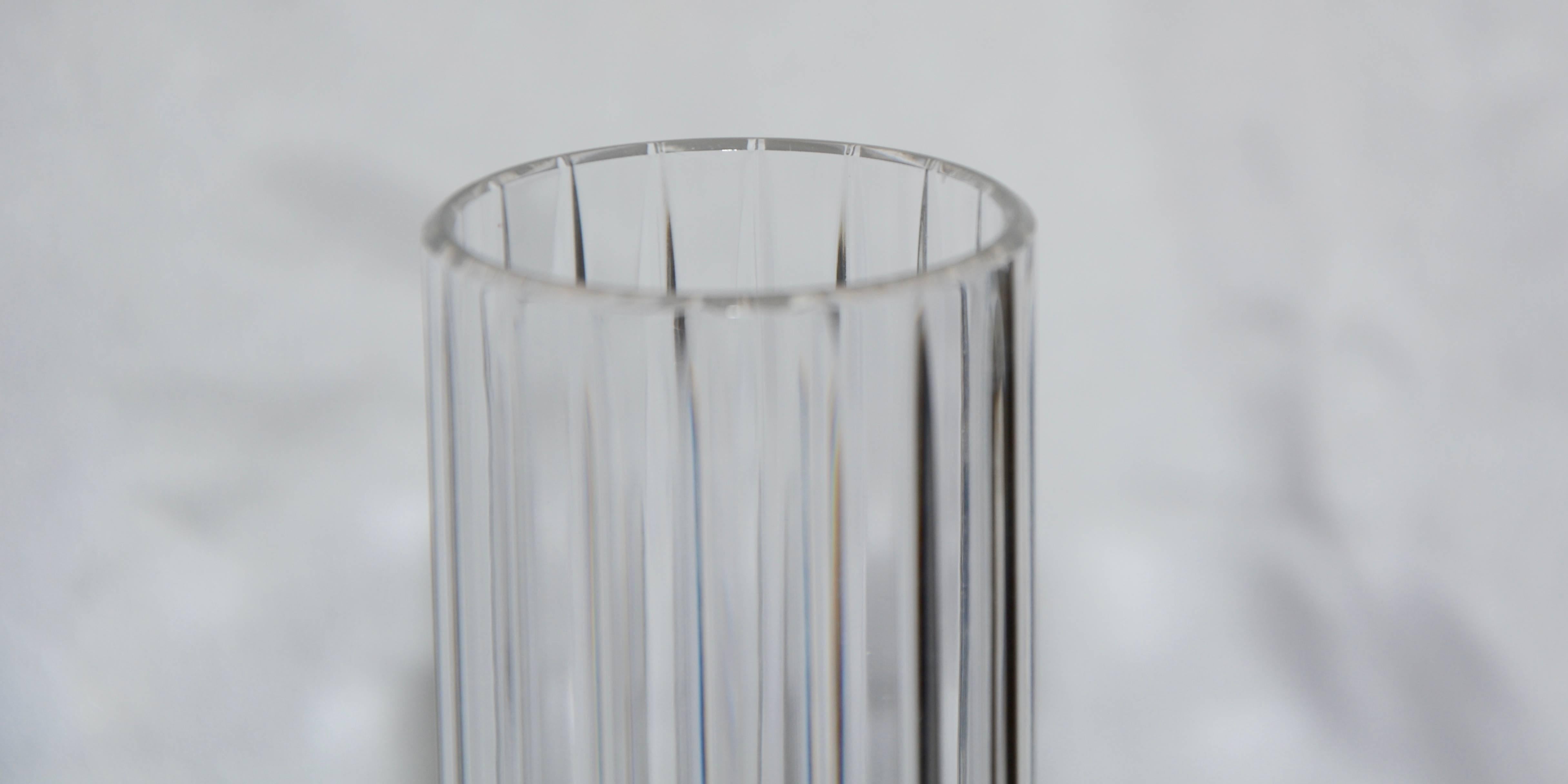 Elegant clear cut crystal forms this daffodil vase by Baccarat of Italy. The vertical ribs are perfectly cut to add to its beauty. The Baccarat mark is on the bottom of the vase.