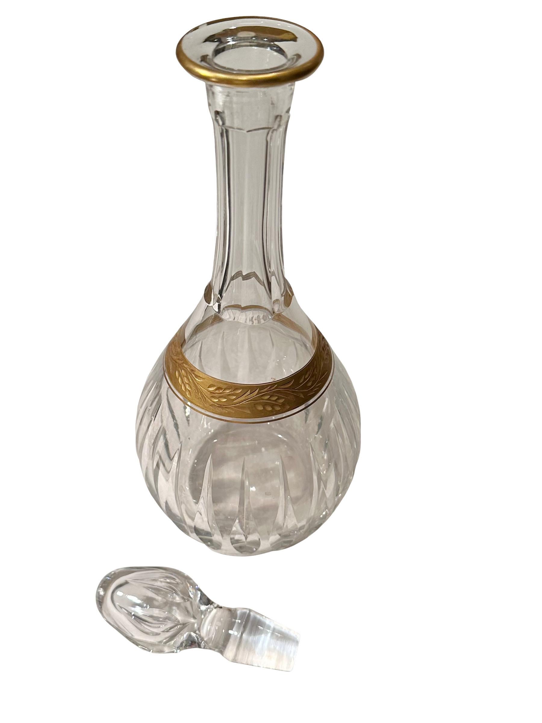 A Baccarat style turn of the century decanter. France, circa 1910.  Beautiful crystal with gold and with its stopper. An elegant bar accessory. 