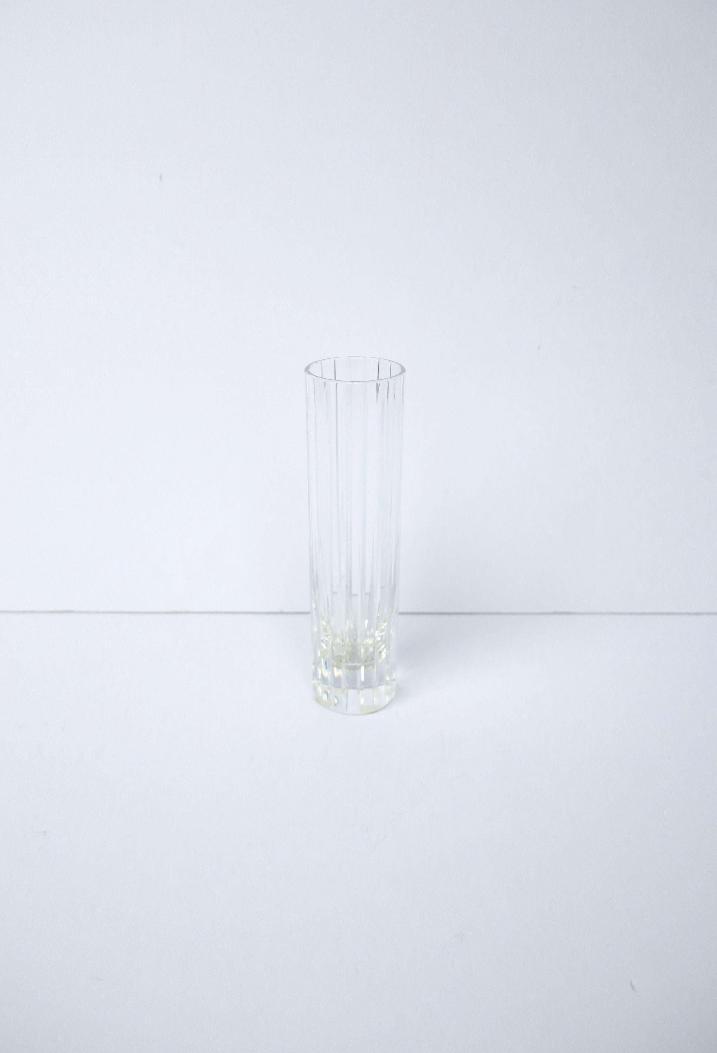 A beautiful and substantial clear transparent crystal vase from French luxury crystal Maison Baccarat, circa late-20th century, France. This elegant vase has long vertical bevel cuts around exterior accentuating its beauty. Beautiful as a standalone