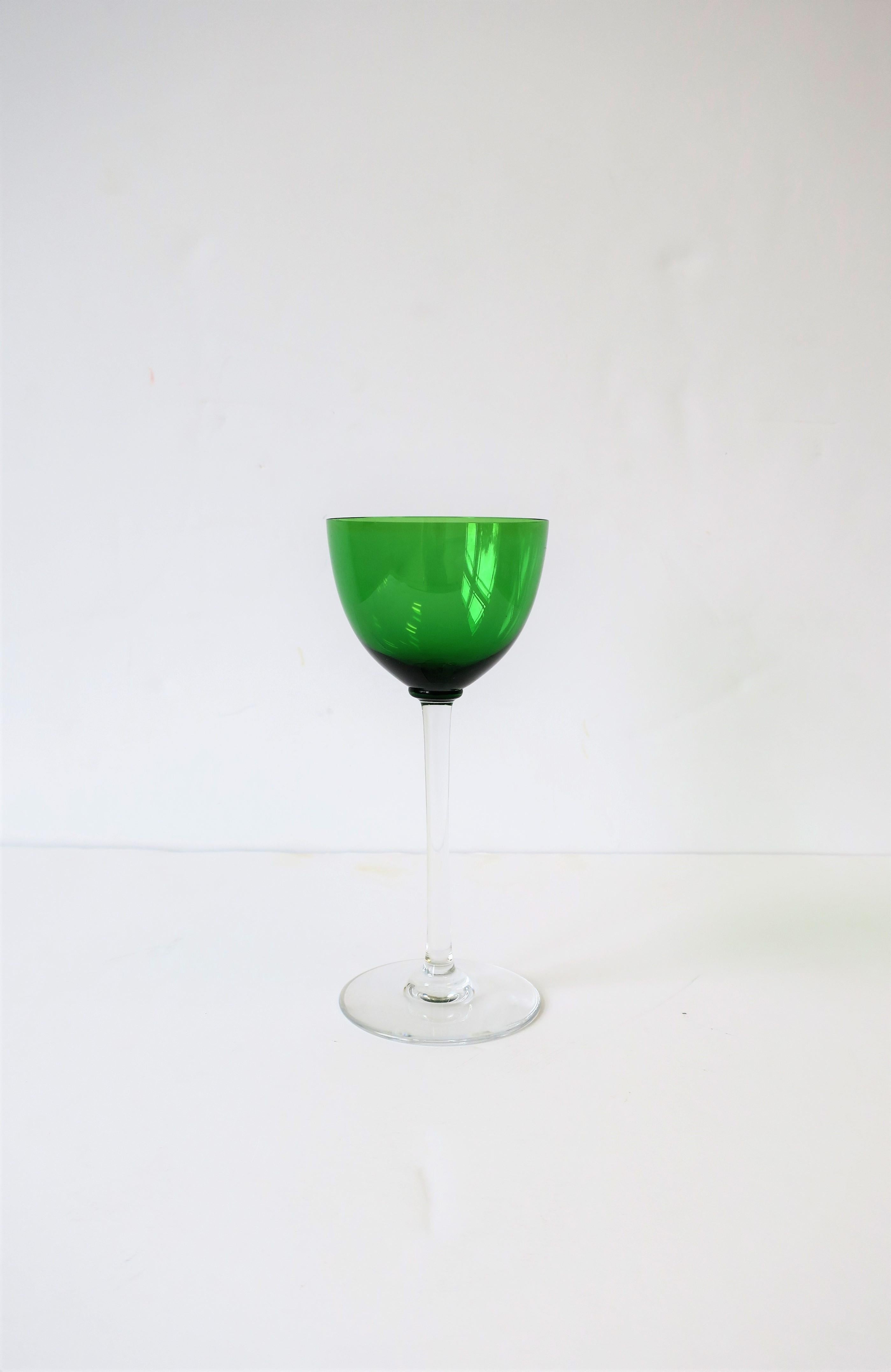 A beautiful French green and clear crystal wine or water glass/goblet by luxury maker Baccarat. Handcrafted crystal glass is 7.5 inches tall. Made in France. With maker's mark, 'Baccarat', and 'France', on bottom as show in image #4.