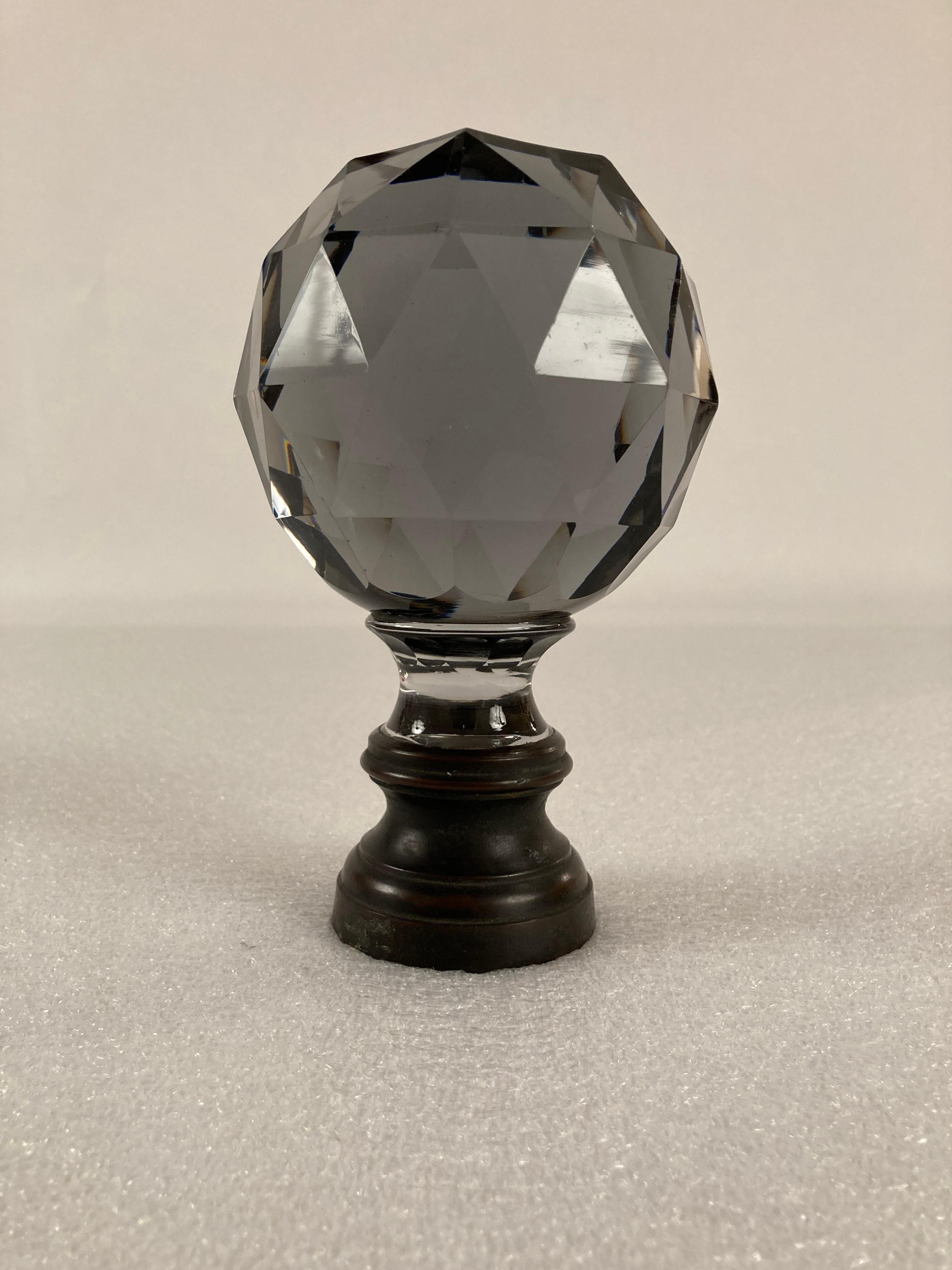 Add a touch of glamour to your staircase with an antique Baccarat cut crystal newel post from the Belle Epoque period in France. Retaining the original bronze mount. This piece wonderful as a decoration on a coffee table or mantle piece, or shelf