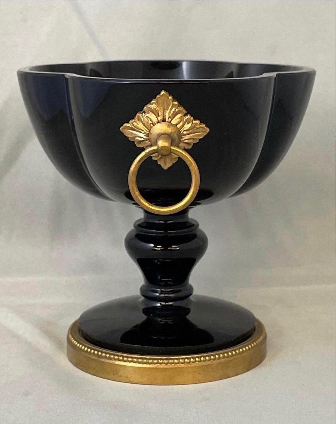 Hard to find form, presents stunning with the modern black glass and sleek gilt bronze mounts. Excellent condition - not a chip or crack on the piece!
Signed to bottom