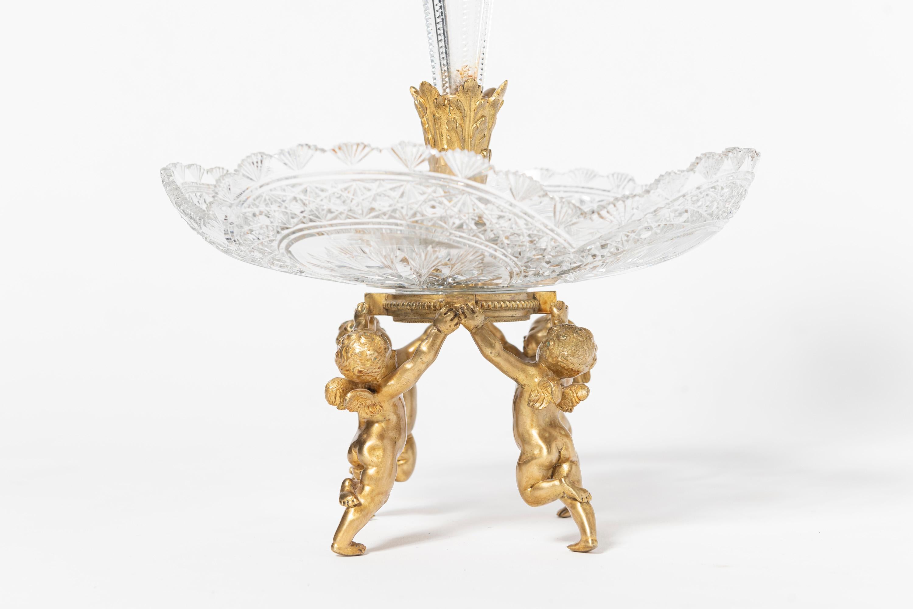 Baccarat glass and gilt bronze center piece with angels. France, early 20th century.