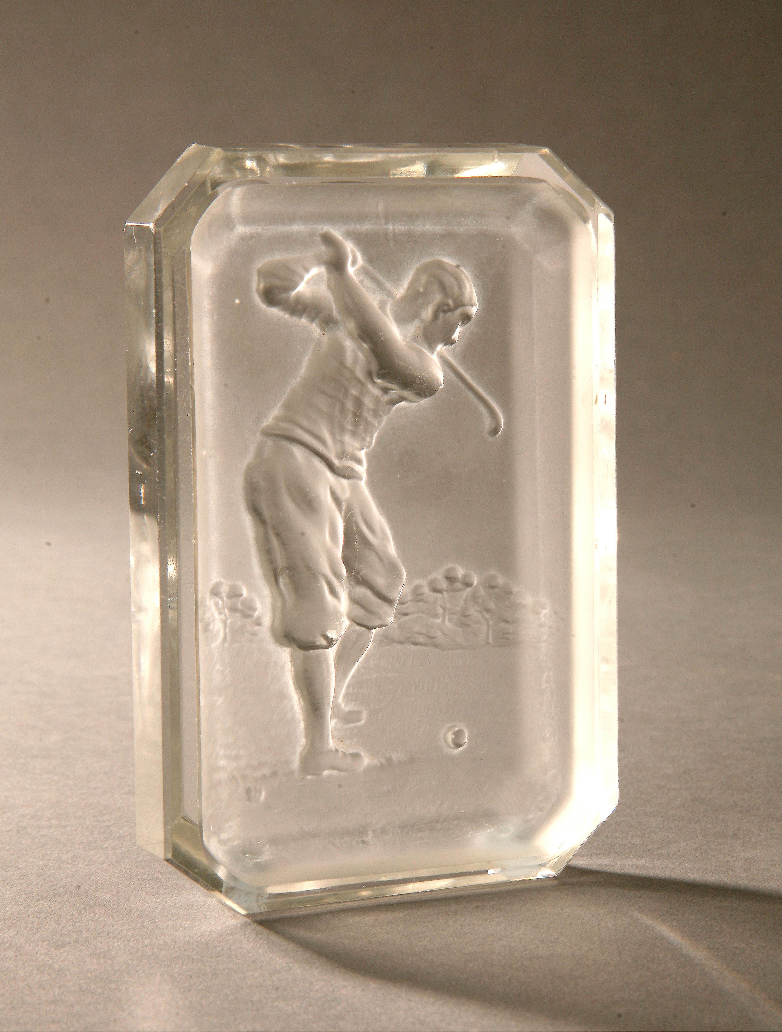 Vintage golf Baccarat glass pin tray.
An original glass Baccarat pin tray, ashtray, with relief golfer in the base. The golfer is in full backswing and the piece is marked with the small Baccarat butterfly mark. The rectangular glass tray is in