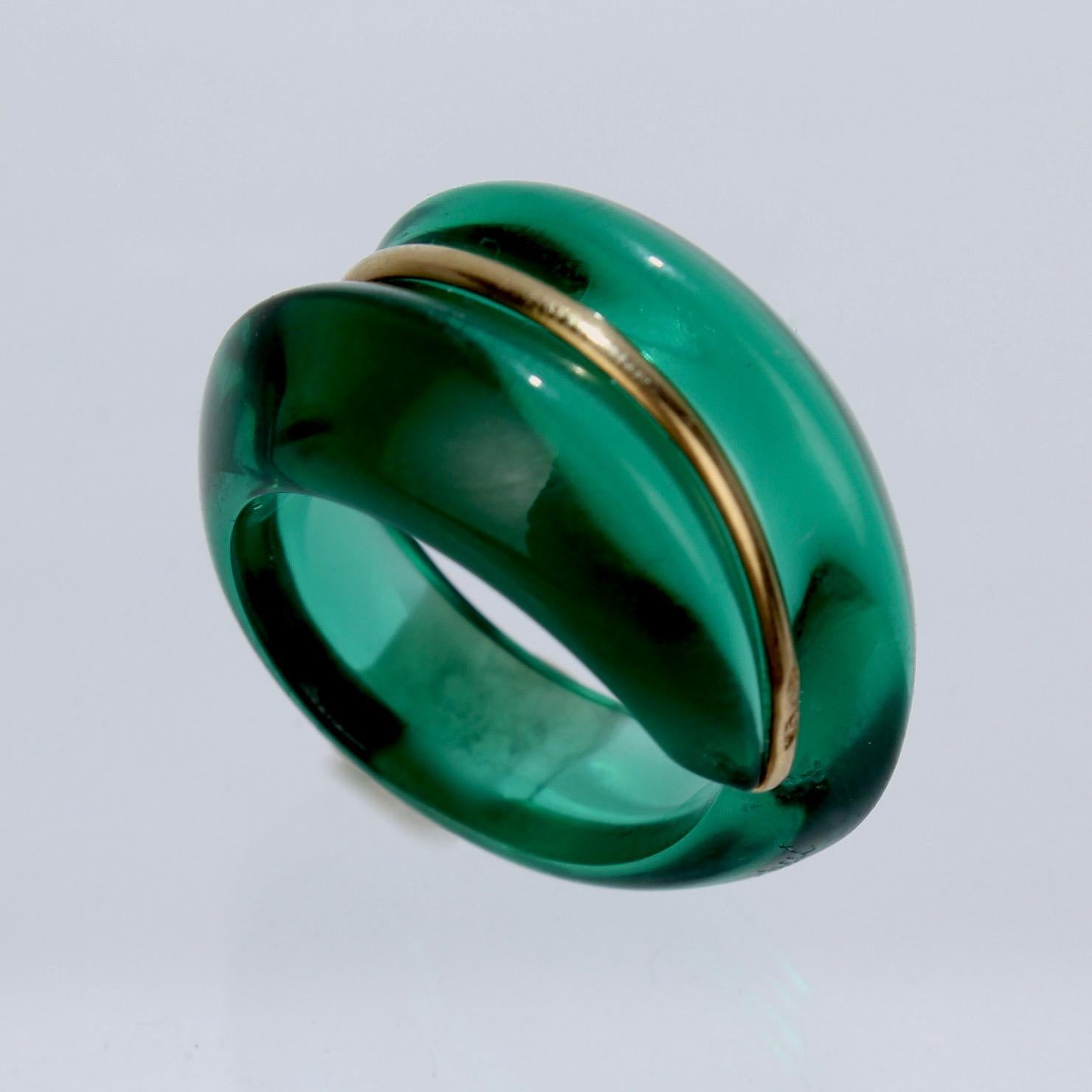 A wonderful Baccarat Coquillage ring.

In emerald green glass and 18k gold.

Great modernist jewelry design from France's premier glass house!

Marked with an acid-etched Baccarat factory mark, a French assay mark, and 750 for 18k gold