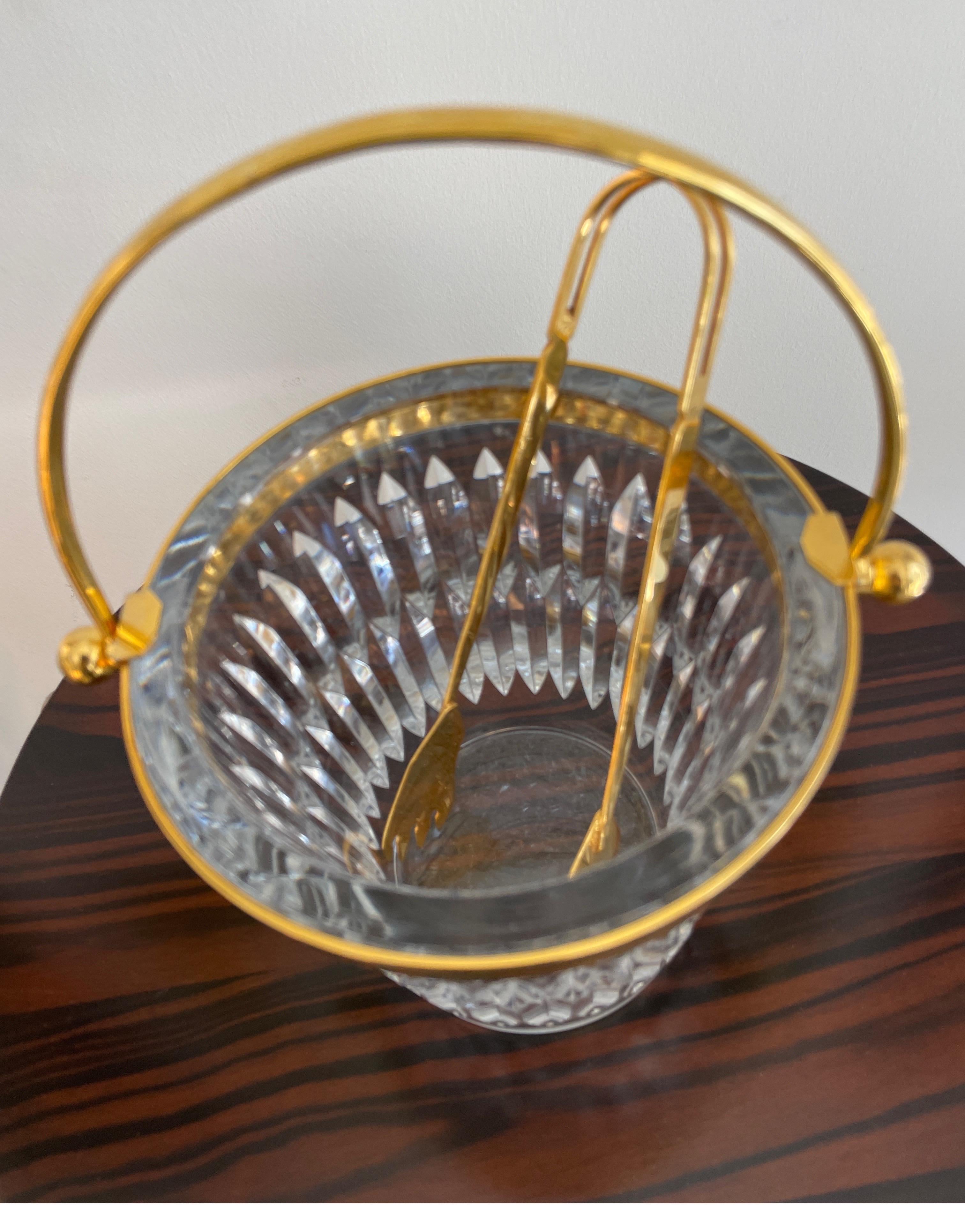 Very chic Baccarat crystal Dore trimmed ice bucket & Tong. This special ice bucket will glimmer in any setting.