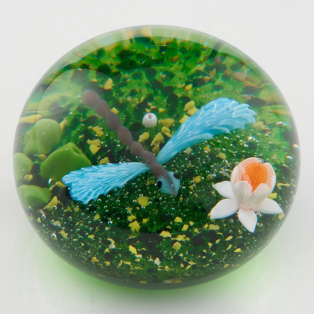 Heading : Baccarat Lampwork Dragonfly Flowers Paperweight 1982
Date : 1982
Origin : France
Features : Lampwork dragonfly and lily on a green ground
Marks : Etched Baccarat 
Type : Lead
Size : 8cm diameter, 6cm height
Condition :