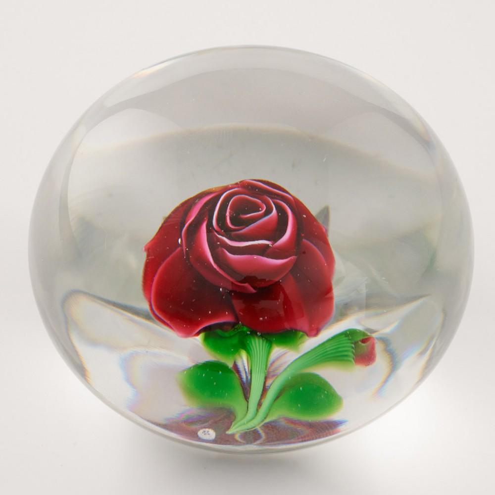Heading : A Baccarat Lampwork Rose & Bud Paperweight 1976
Date : 1976
Origin : France
Features : A fabulous red rose, bud, leaves and stem on a clear ground and star cut base
Marks : Incised on base 83/ 150 and dated 1976
Type : Lead
Size : 7.8cm