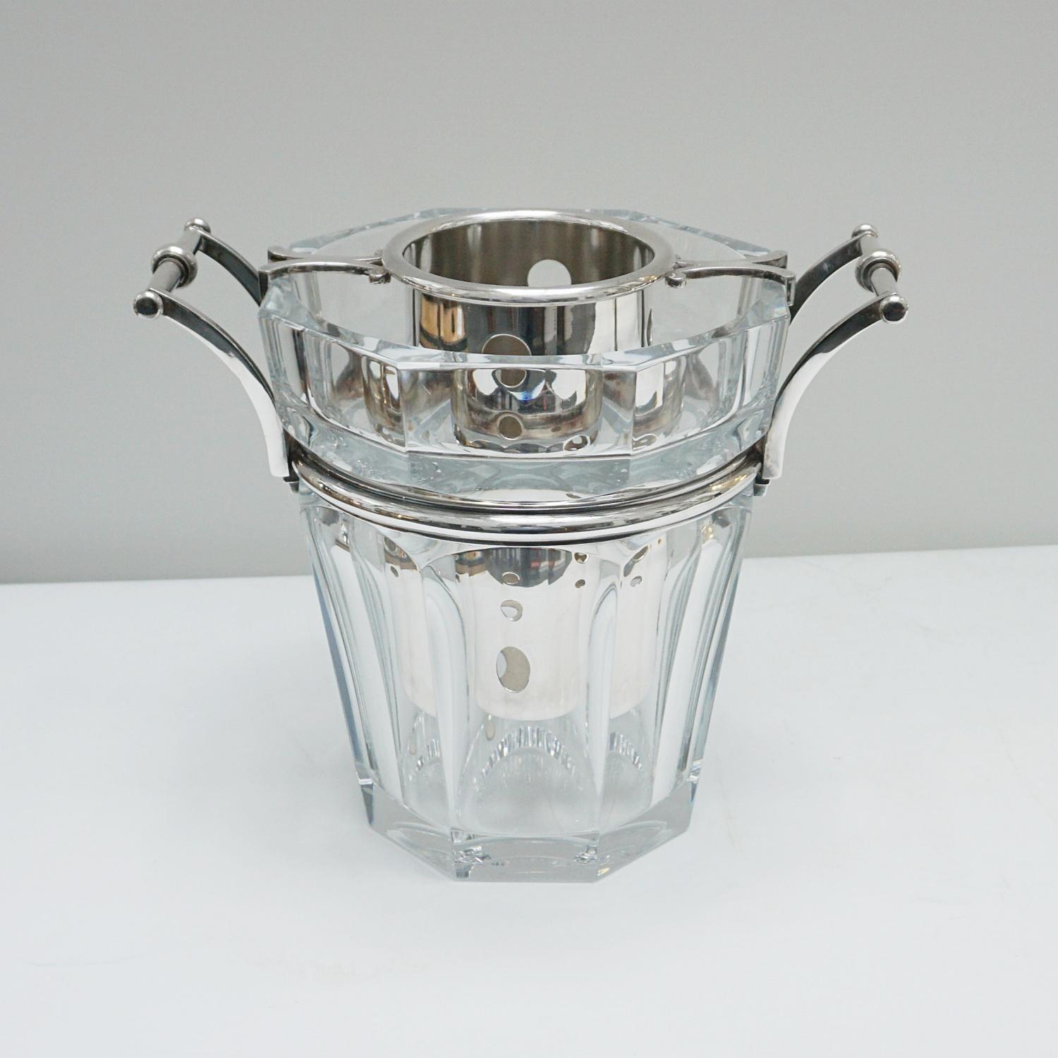 A mid-century crystal glass and silver plated champagne/wine bucket and cooler. Silver plated handles and cooler insert. Stamped 'Baccarat France' to underside. 

Dimensions: H 23cm W 20cm D 20cm

Excellent Original Condition 

French, Circa