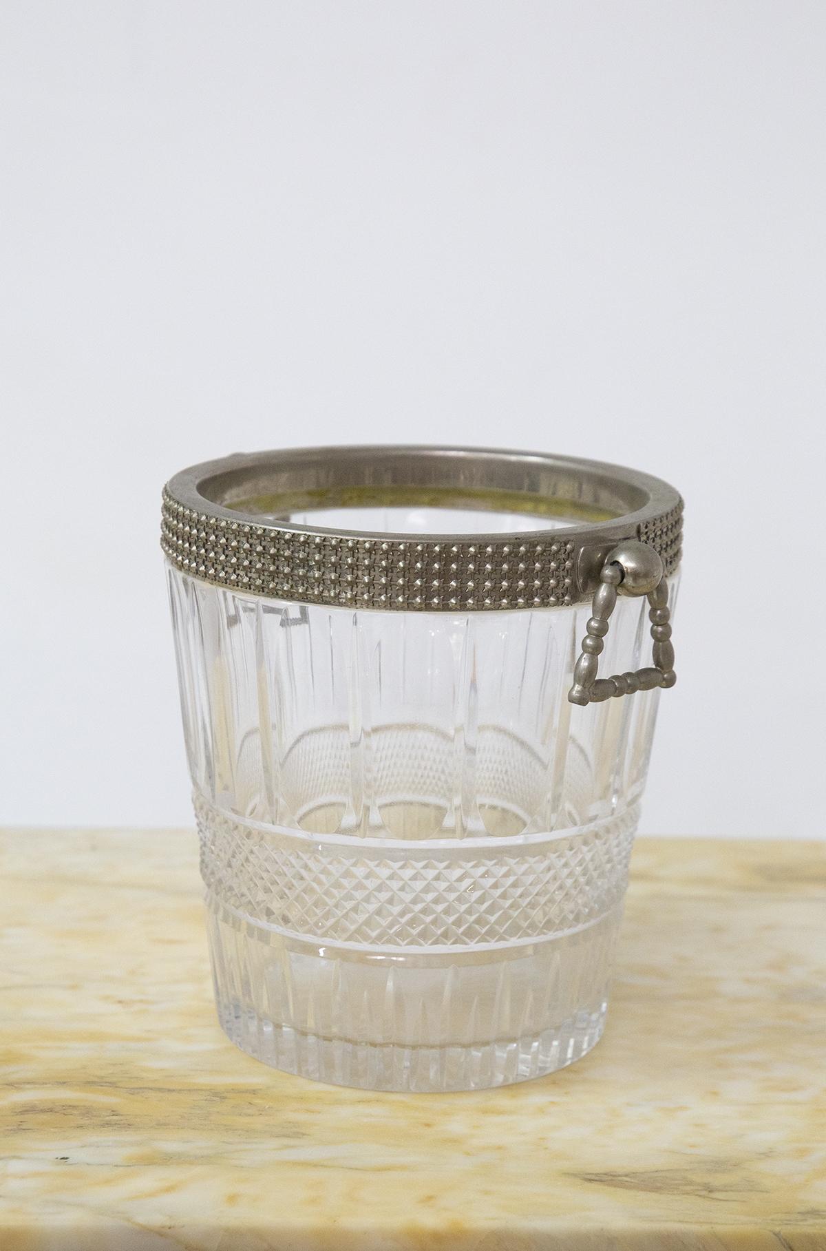 Beautiful round shaped beverage or wine basket produced in the 1950s by Baccarat, fine glassware.
The basket has a cylindrical shape made entirely of clear crystal, with various workings and inserts, making it a star piece on the table.
At the top