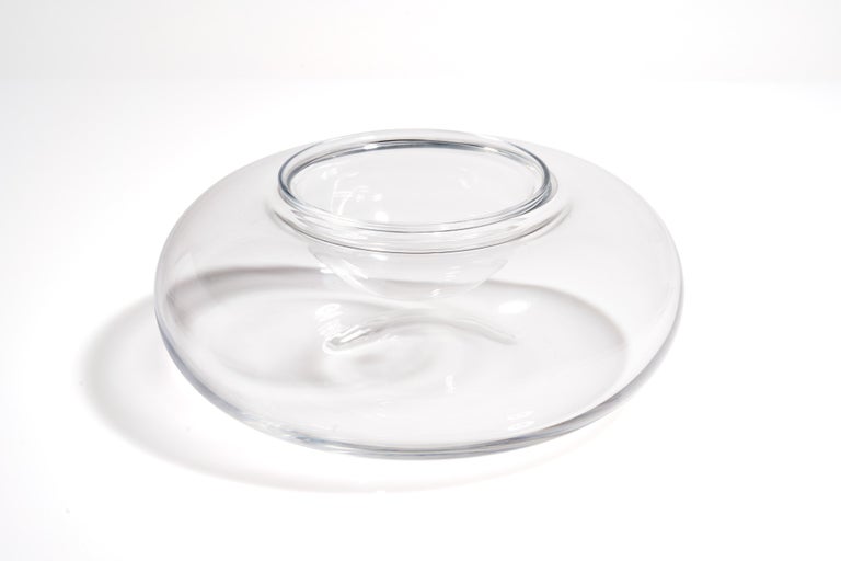 A simple yet elegant caviar service from the famed Baccarat. A beautifully rounded crystal body holds a simple votive for your caviar. Marked on bottom.

Measures: 8
