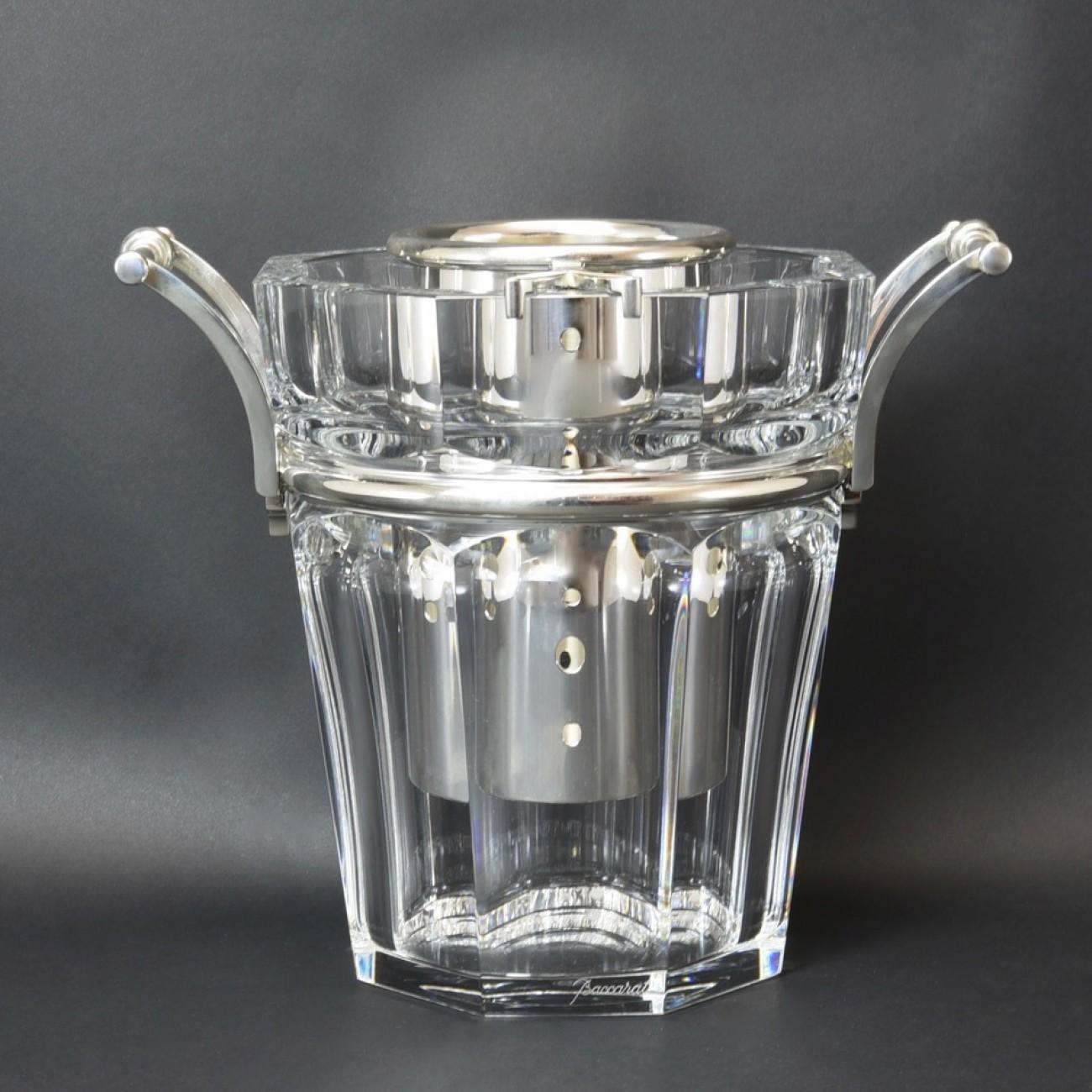 A superb Baccarat octagonal cut crystal and silver plate wine cooler (model 'Moulin Rouge') designed so the bottle can sit upright in a purpose made cradle if so desired or it can be used without the cradle so the bottle sits directly in the ice,