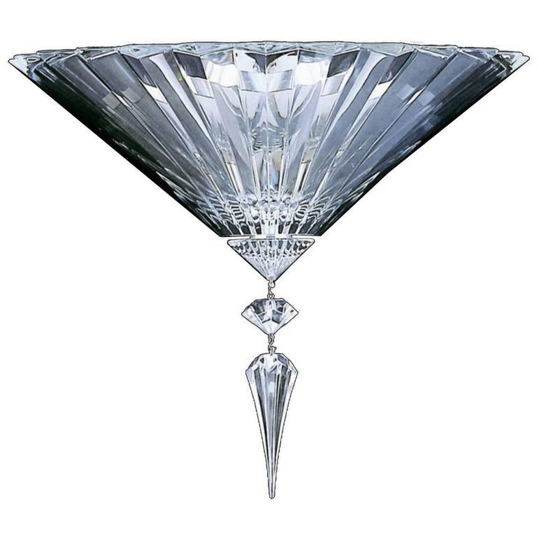 This crystal pair of wall lights sconces is a prime example of the finest Baccarat craftsmanship. The collection Mille Nuits further highlights the crystal's exceptional light-scattering properties.
Baccarat guarantee attached. 
We are authorized