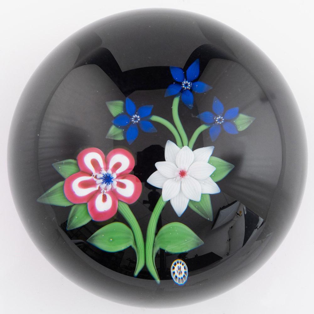 Heading : Baccarat Paperweight with Lampwork Flowers
Date : 1982
Origin : France
Features : Lampwork pansies and clematis with leaves and stems on a blue ground
Marks : B1982 signature cane, etched Baccarat mark, 80/175  1982
Type : Lead
Size : 8cm