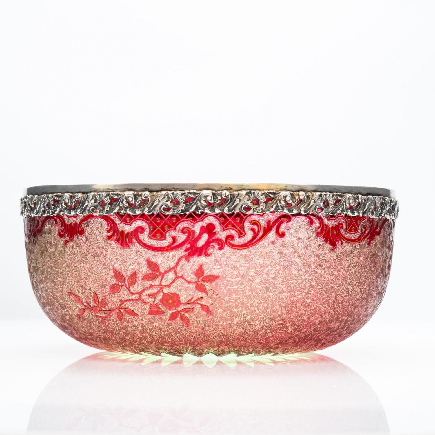 Glorifying the effects of refracted light for 170 years, the iconic Baccarat products are well-known all over the world.

A  Large Art Nouveau Baccarat egelantier and leaf pattern acid etched bowl with silver edge. Floral cut to clear decoration