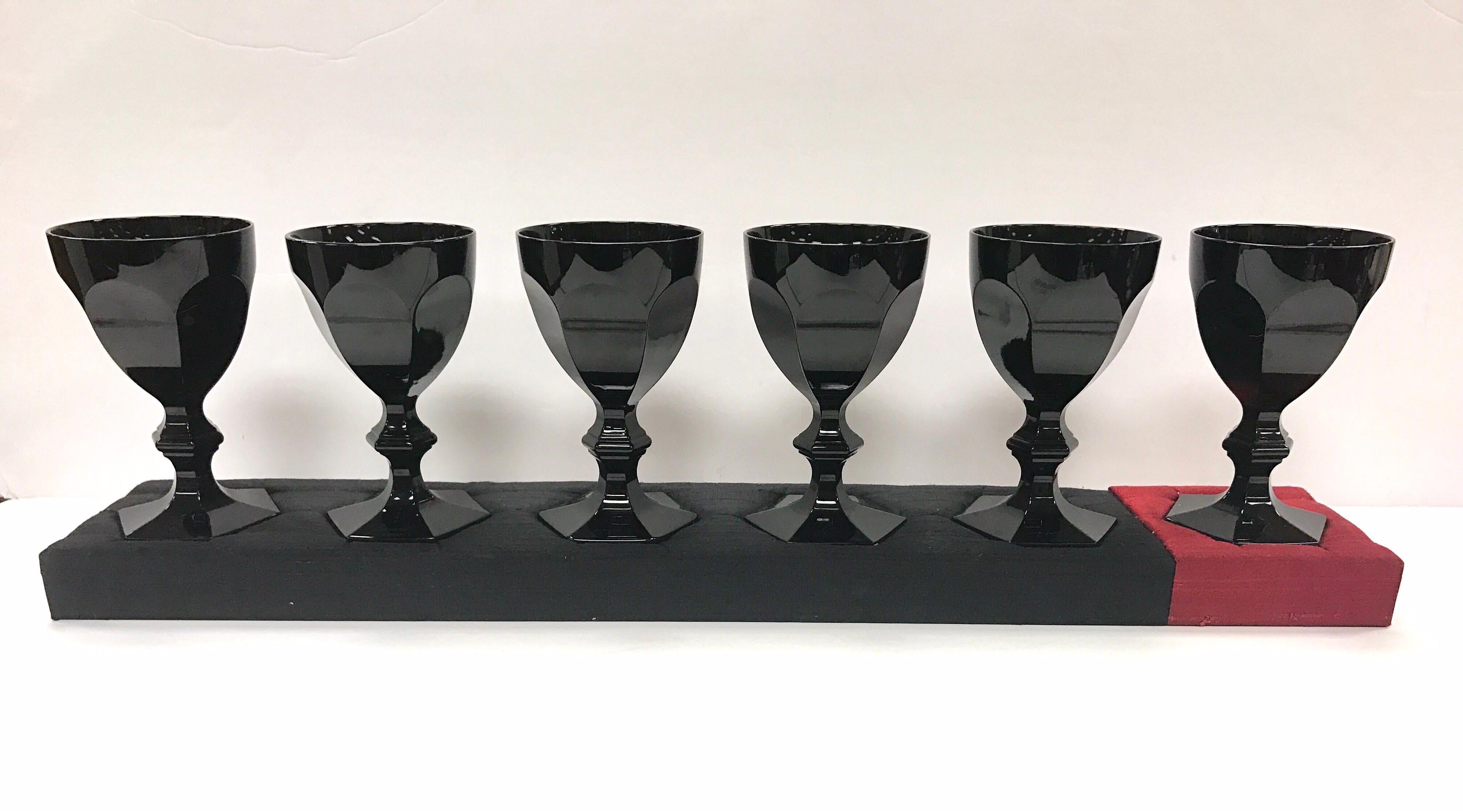 Rare set of Baccarat Harcourt Darkside black goblets with Philipe Starck signature on all. Includes the rare, hand-signed plexiglass case that covers all six fitted pieces and comes with Jean Cocteau phrase and signature.