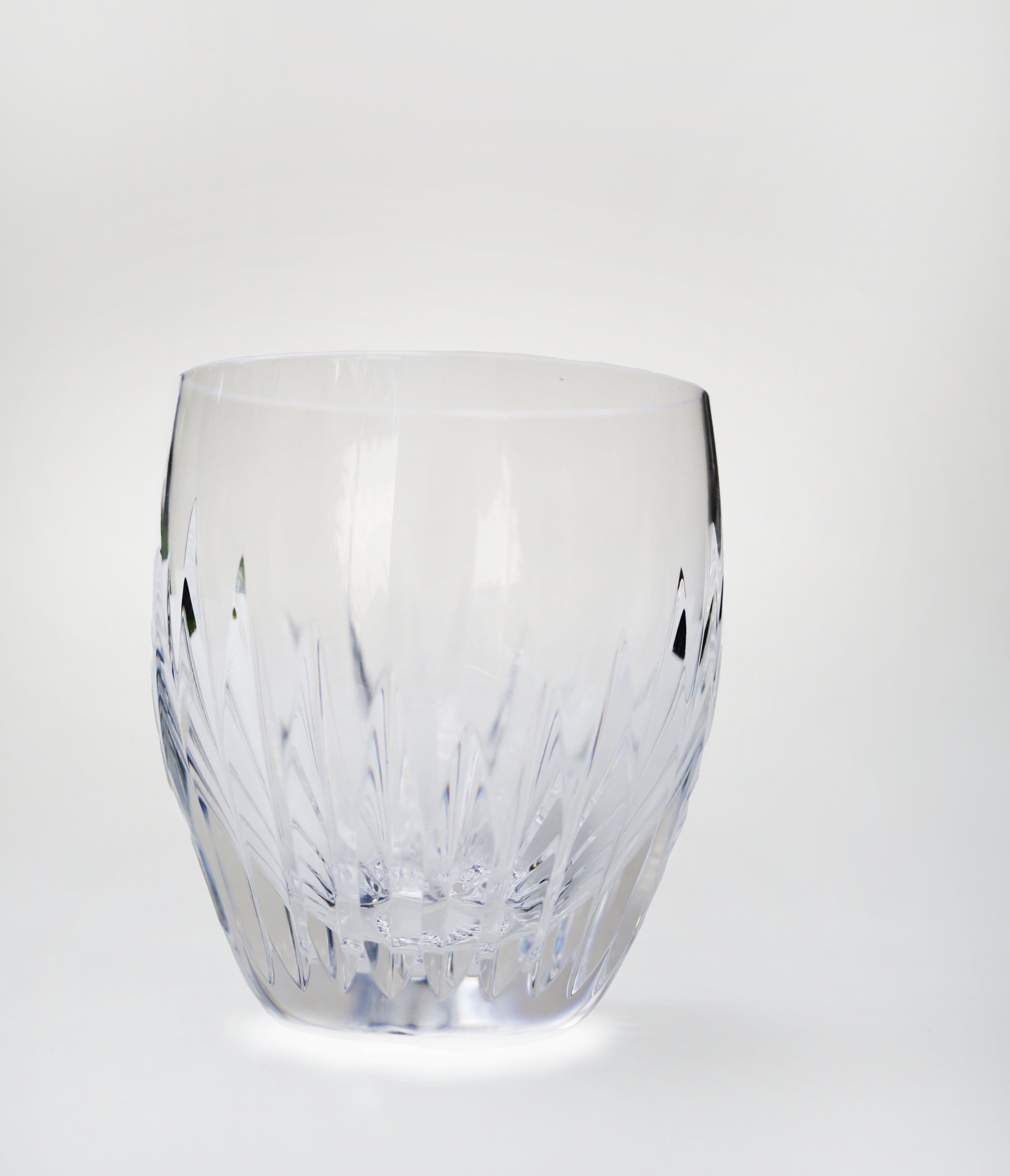 Deep orgue bevel cuts, irradiating from the base, are etched directly into the Clear crystal. The intricate detailing gives the Massena tumbler a barrel-like appreance and a textural feel. This artful handiwork puts the upper smoothness of the glass