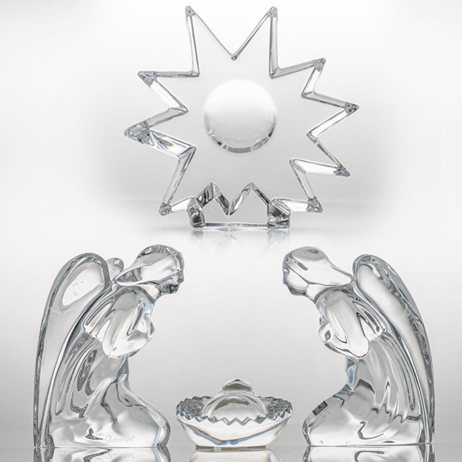 Luxury at its finest,  A collector’s item made by Baccarat in France.

This exquisite Baccarat crystal nativity set captures the serenity and grace of the Christmas story. It features two sculpted kneeling angels, a finely detailed crib, and a
