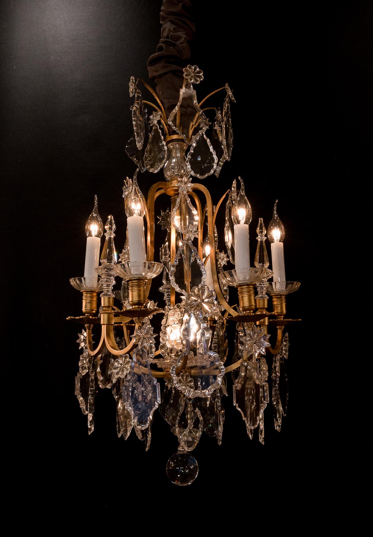 Baccarat signed - French Louis XV style, patinated-bronze and crystal chandelier, circa 1900.

Lovely patinated gilt-bronze and crystal chandelier in the classic French Louis XV style, signed by The Cristalleries de Baccarat.
Our chandelier is