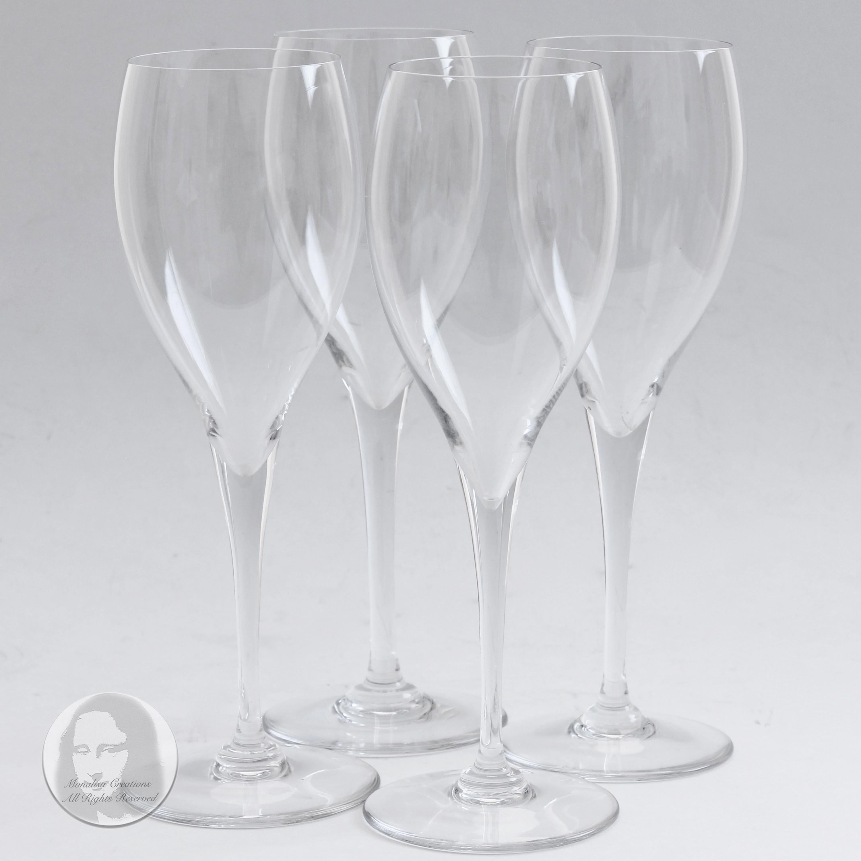 Preowned, authentic Baccarat St. Remy pattern champagne flutes or tulips, likely made in the 80s. Made from crystal, these elegant stemware pieces will add a touch of luxury to your gatherings and celebrations! 

No box but this set of 4 pieces will