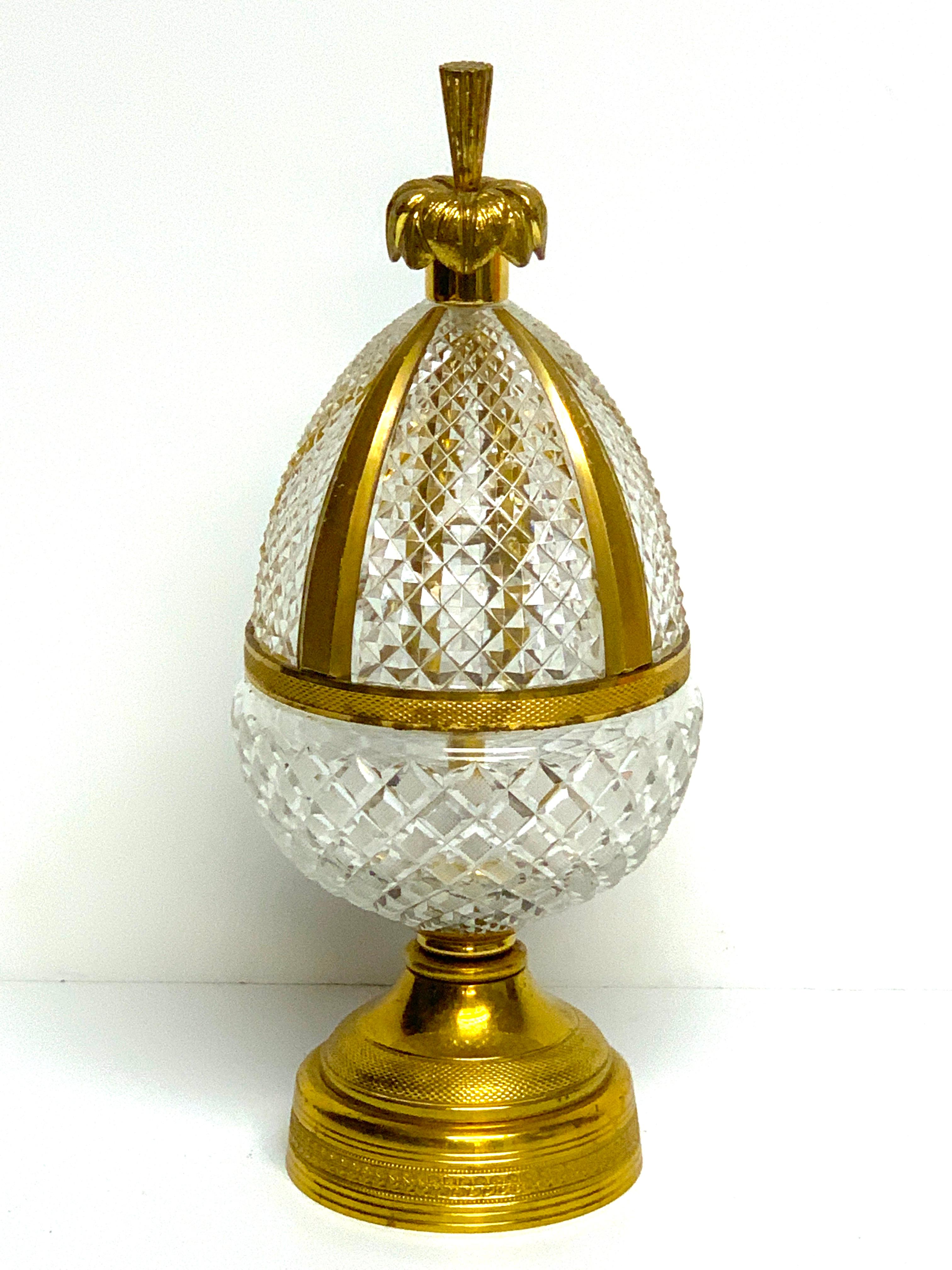Baccarat style ormolu, cut and gilt crystal newel post, of egg form finely cut and faceted, raised on a 4-inch diameter base.