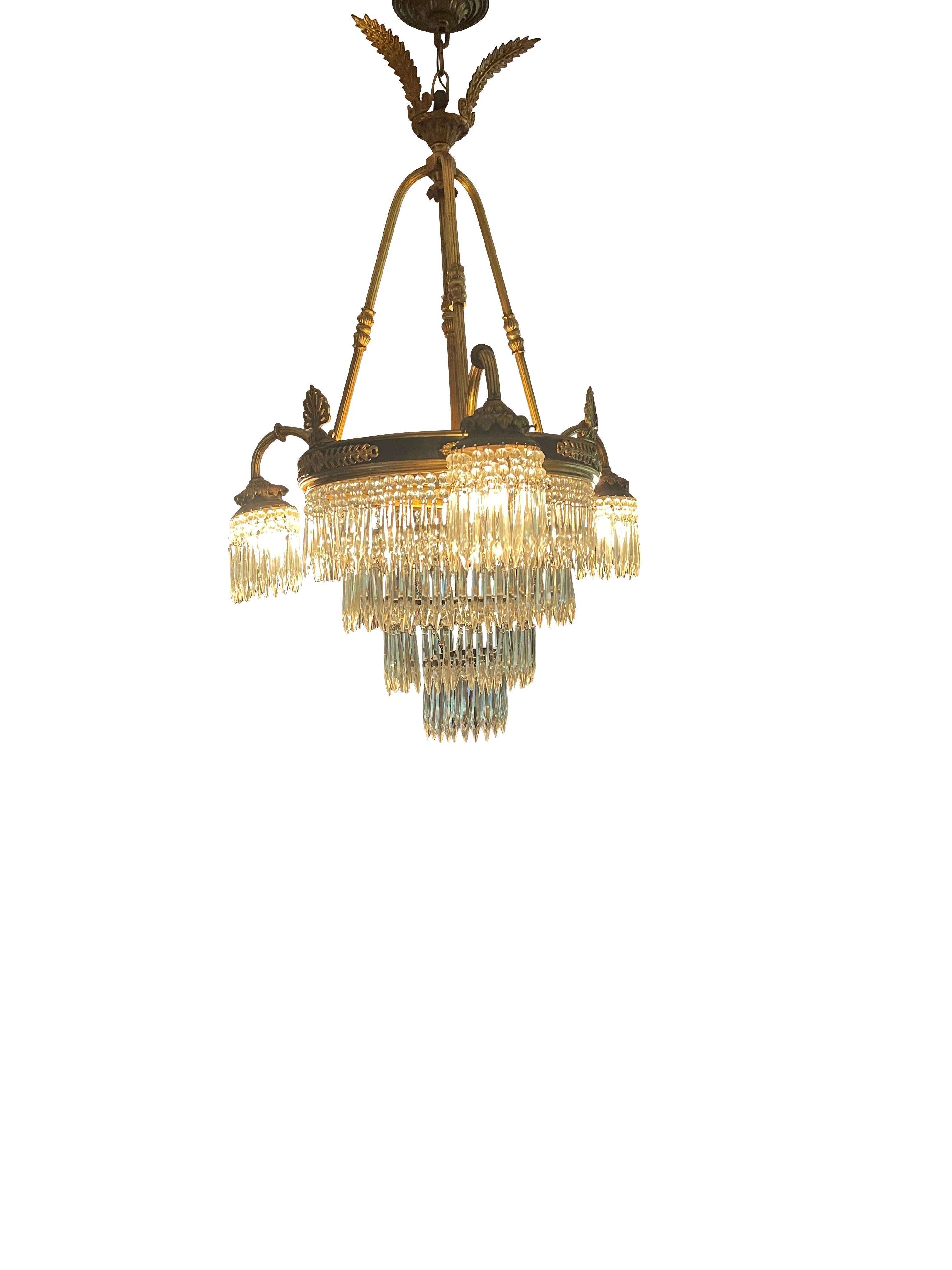 French 20th century Louis XV style Baccarat crystal and ormolu chandelier
An elegant French 20th-century Baccarat crystal and ormolu chandelier. The chandelier is centered by a stunning array of Baccarat-style crystal arrow-shaped prisms, each