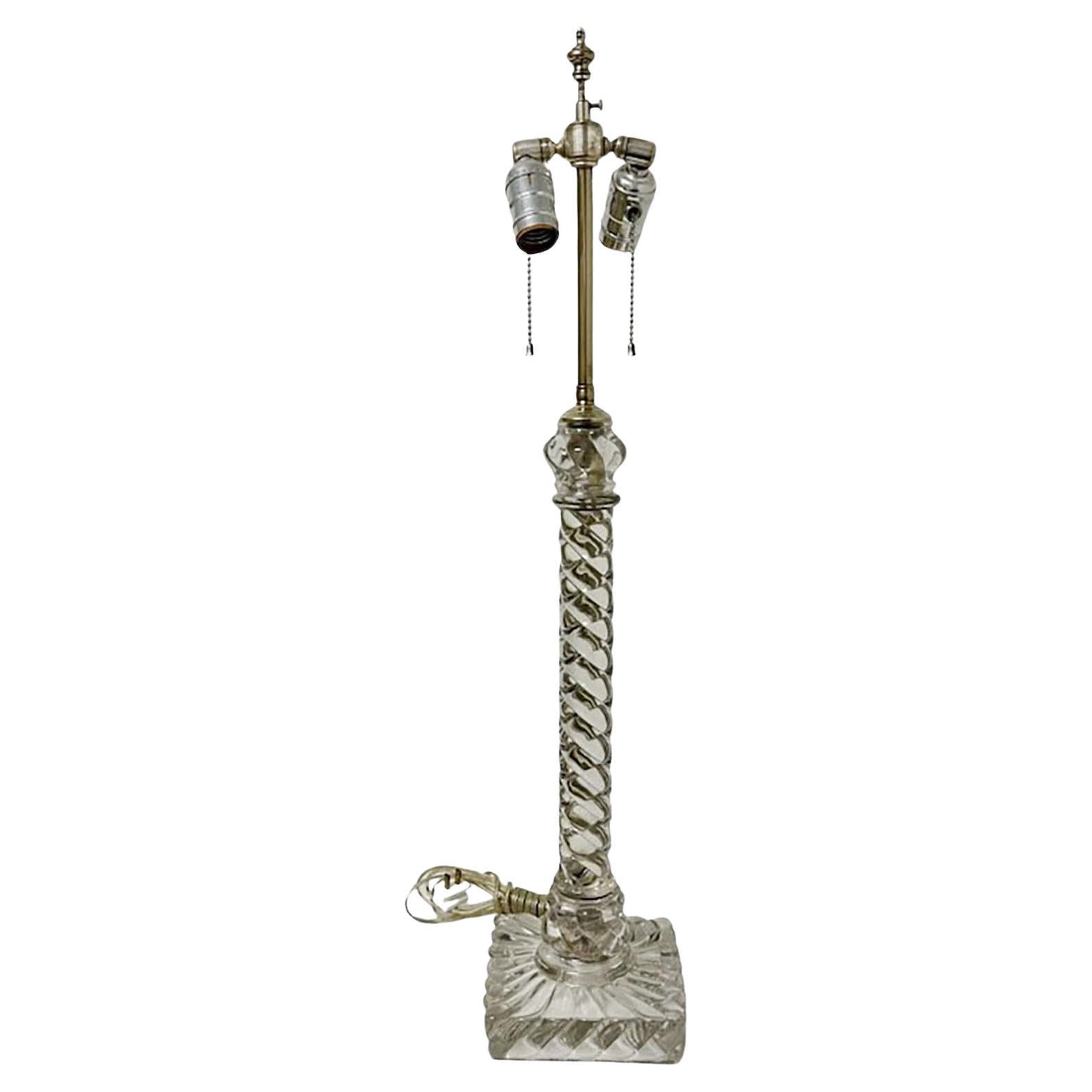 Baccarat swirl table lamp, circa 19th century, France. Originally it was probably an oil lamp that has been electrified. Has a new cord it is wired from the back and has silver cord, sockets and pull chains.