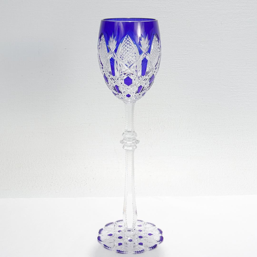 A wonderful & rare Baccarat wine goblet in the coveted Tsar pattern.

Initially introduced in 1906.

In colored cobalt blue overlay glass with a scalloped foot and palm & leaf cut decoration.

Marked to the base with a factory acid etched mark