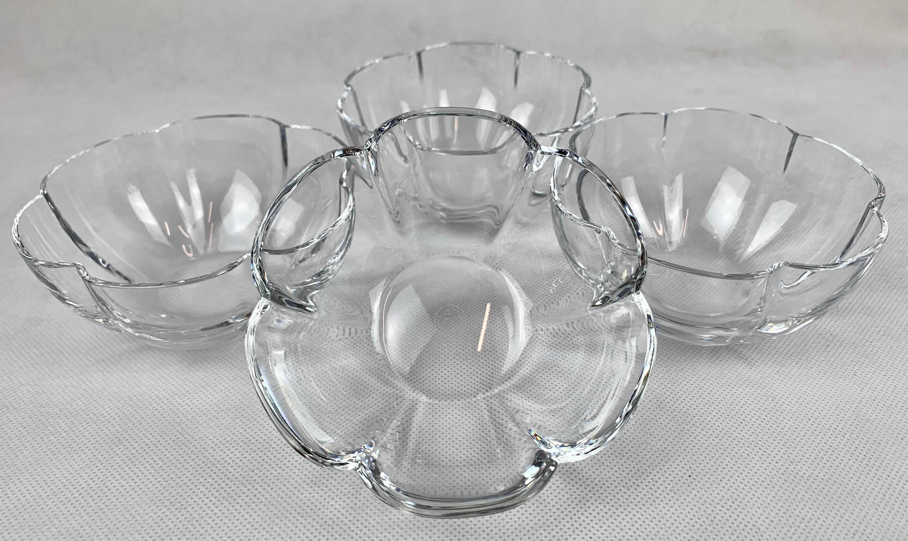 Set of four Baccarat clear crystal corail lobed melon shaped bowls. These would be ideal for desserts or chilled soup. They are in fine condition. There are no cracks or chips. Original retail price $168 each.
Measures: Width 4.5