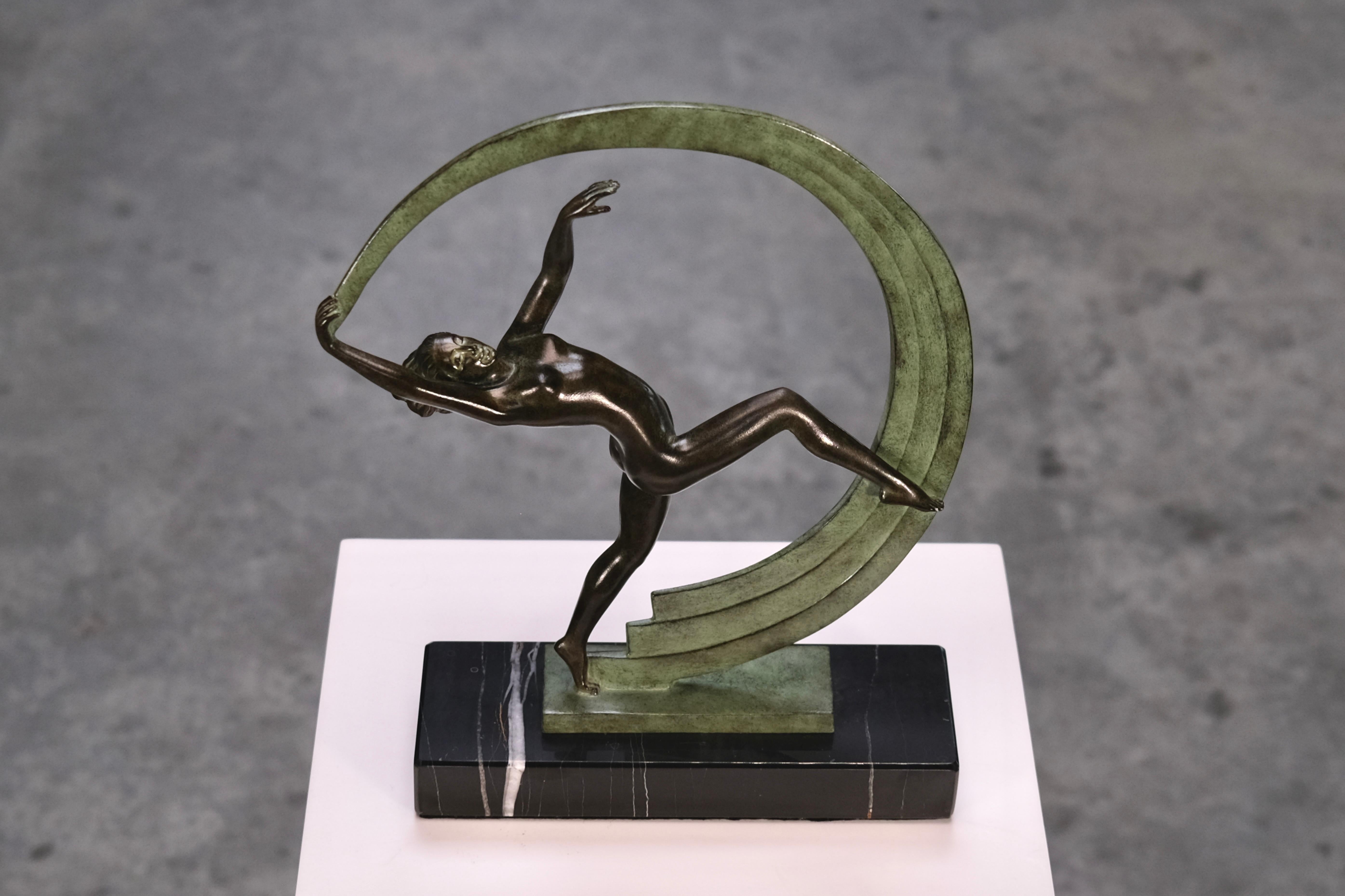 Step into the refined elegance of the Roaring Twenties with BACCHANALE, a stunning Art Deco sculpture by Janle, meticulously produced in the 2020s by the renowned Atelier Max Le Verrier in France. Crafted using the original molds from the 1920s,