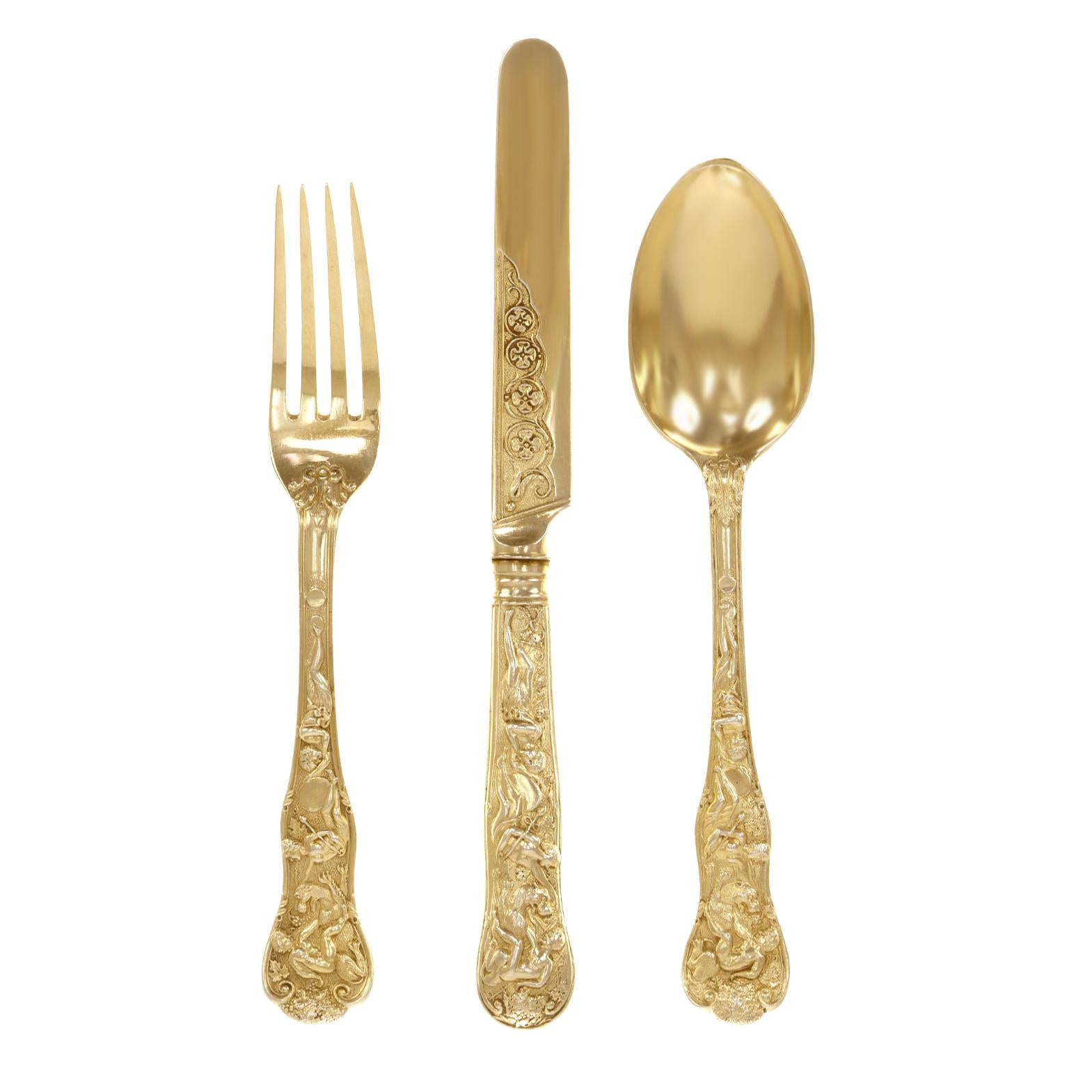 Circa 1898, Gilded Sterling, by James Wakely & Frank Clarke Wheeler, London, England.  This spectacular Sterling Gilt canteen or set for 18 in the Bacchanalian pattern is widely considered to be the most desirable and rarest British flatware ever