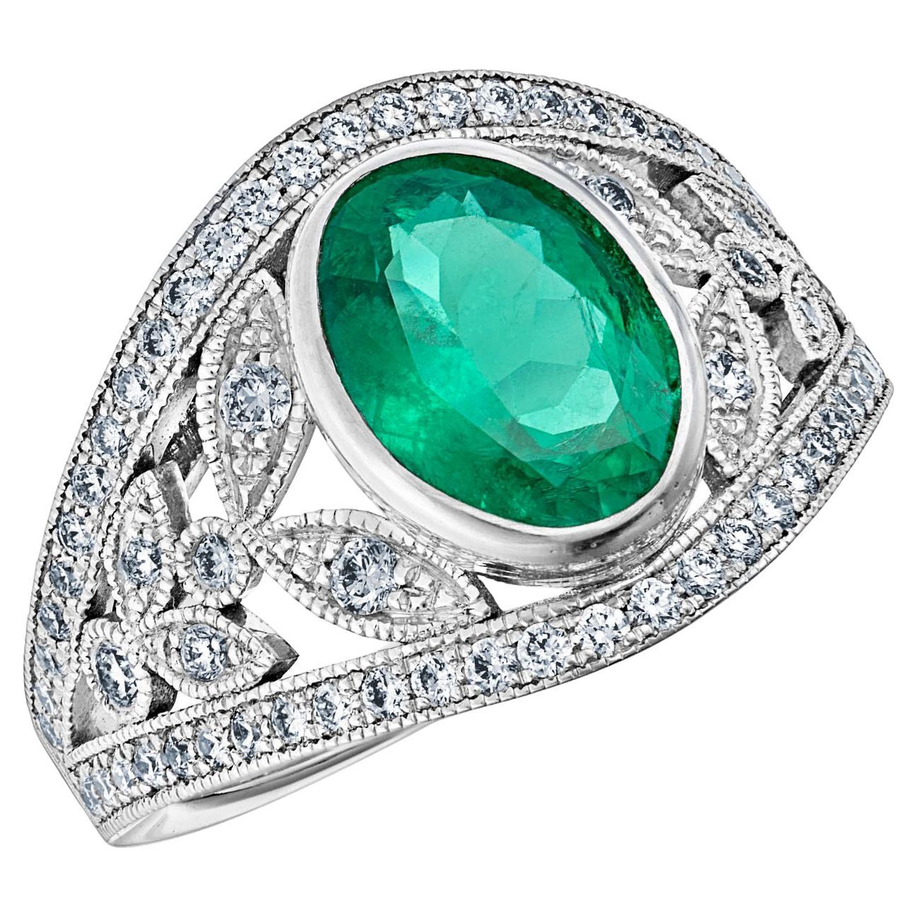 For Sale:  18k White Gold Laurel Leaf Design 1.28 Ct Vivid Green Oval Emerald Ring