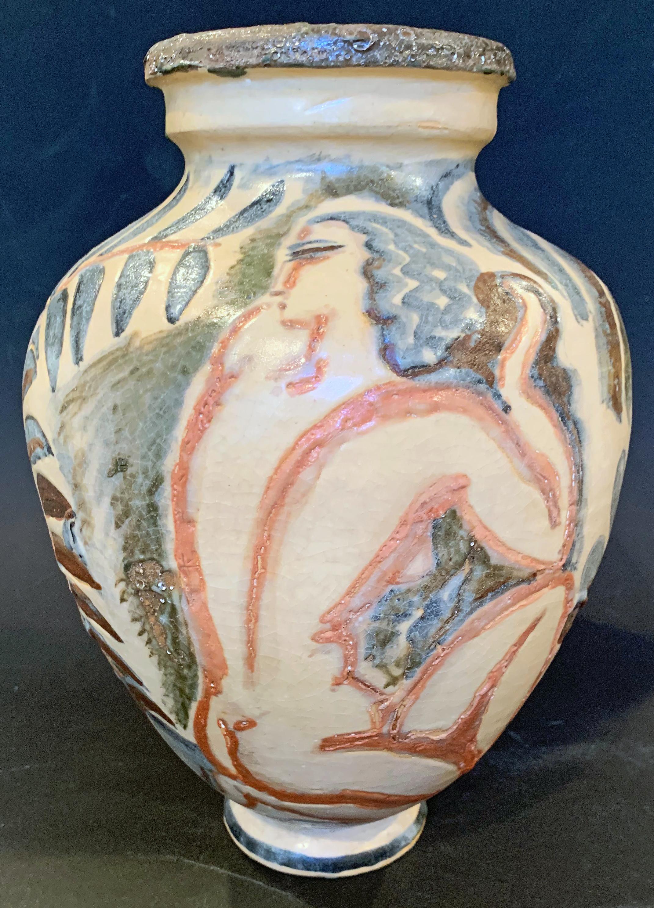 Designed and glazed by René Buthaud, arguably the world's finest sculptor/ceramicist working in the Art Deco manner in the 1920s and 1930s, this superb vase depicts two nude figures: a Bacchus on one side, holding aloft a cluster of grapes, and a