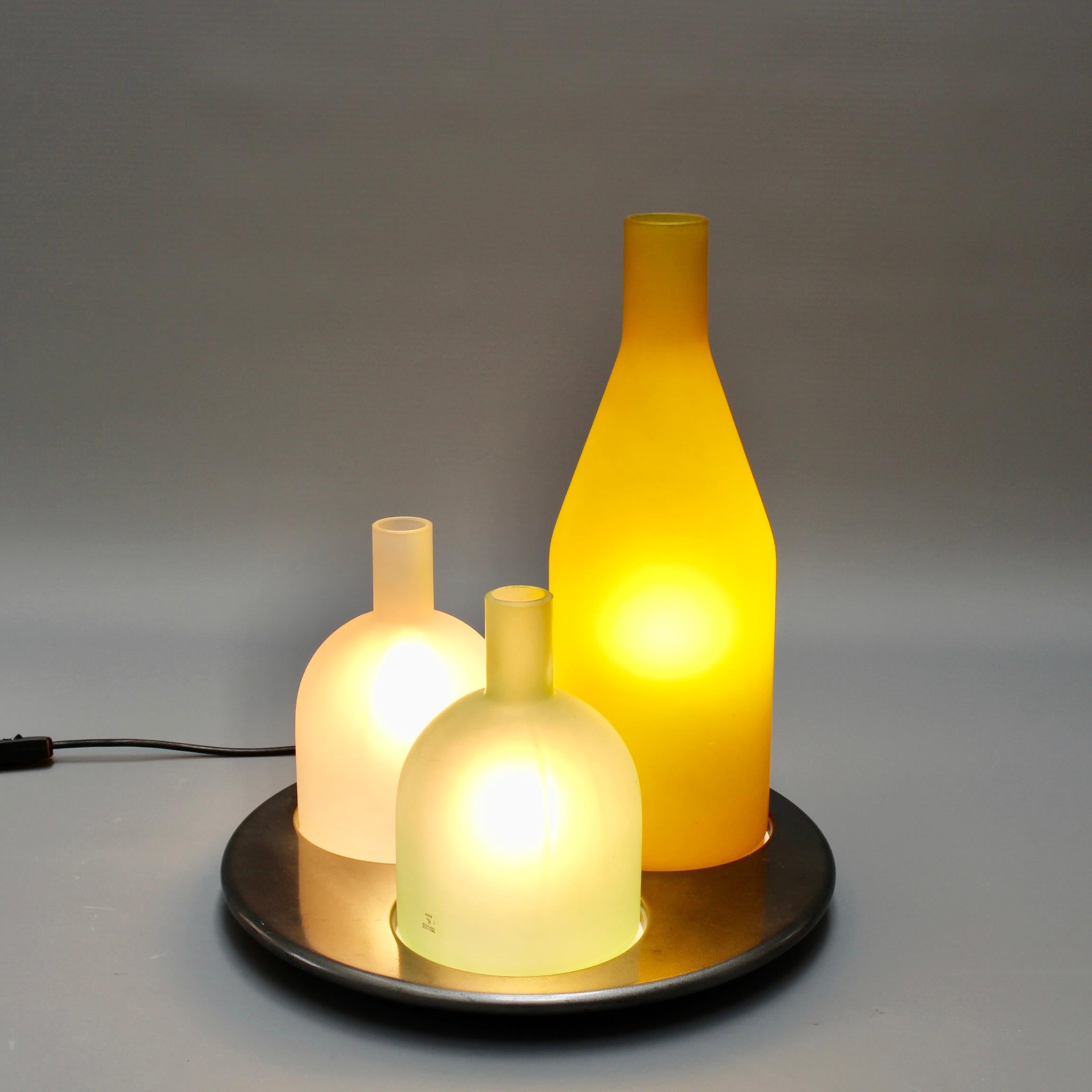 'Bacco 1-2-3' Italian Murano glass table lamp designed by Gido Rasati for iTRE, circa 1980s. ITRE is a contemporary Italian Murano glass lighting company founded by Carlo Nason who started the company in Murano, Italy. Each bottle-shaped light cover