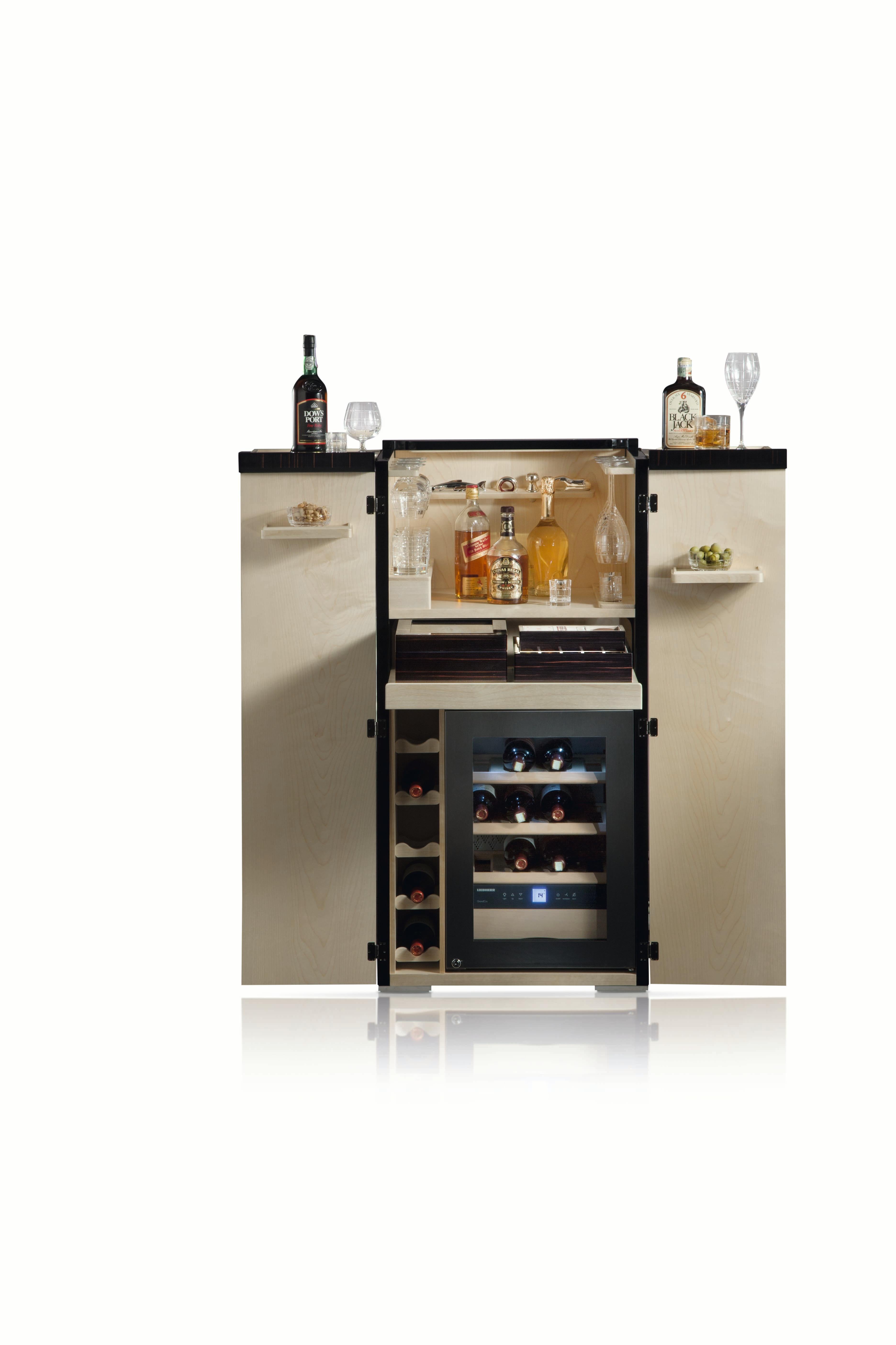 Bar armoire with two doors and lid that can be fully opened. Contents: LIEBHERR wine cellar for 12 bottles, temperature ranging +5 to +20, set of 16 hand cut crystal glasses, wine accessories. Lower drawer with 30 cigars humidor, poker chips,