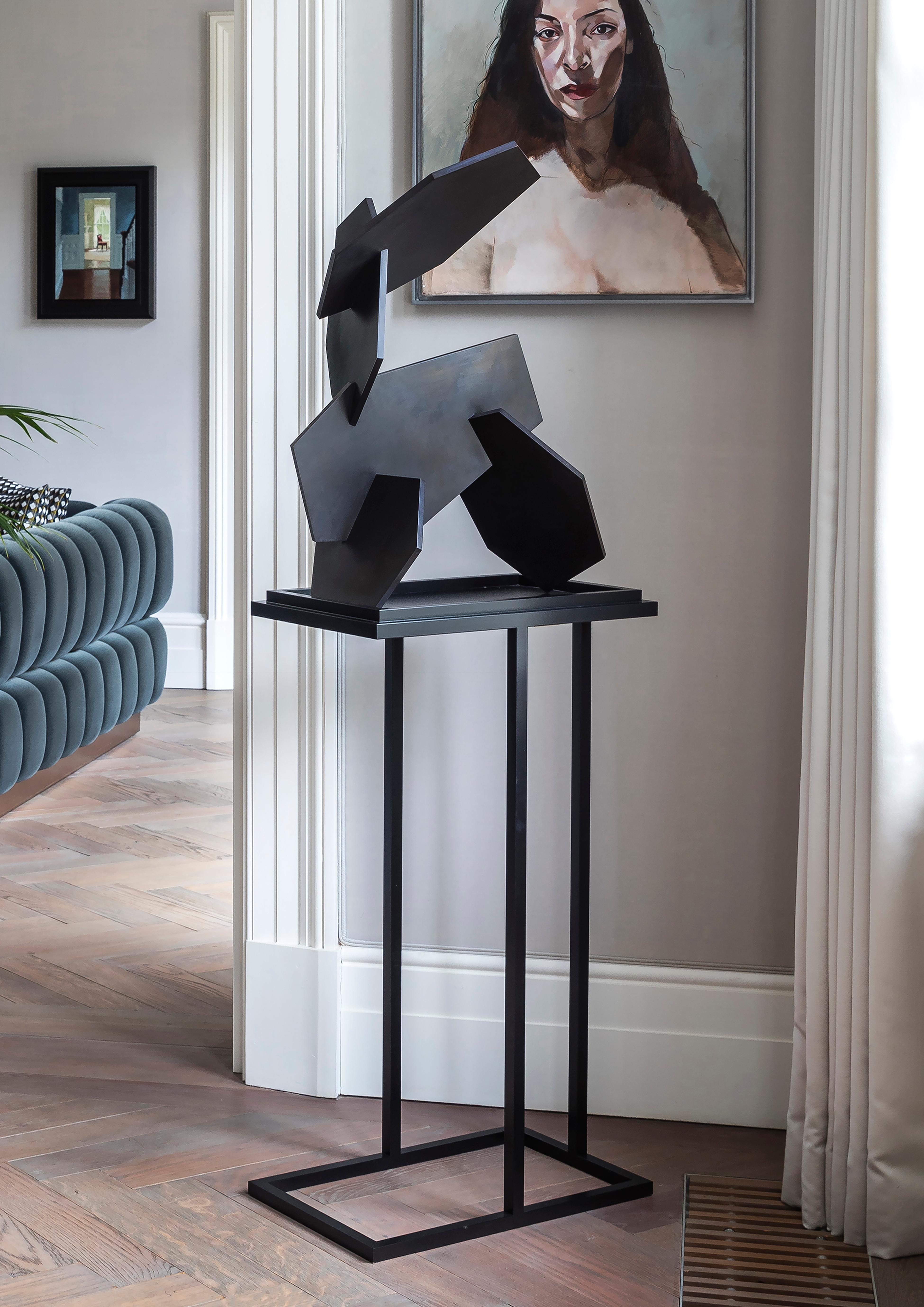 Brother to the Bacco side table, the Bacco Pedestal possesses the strong lines and masculine glamour that the Bacco collection is known for, while also exuding a chic elegance due to its cantilevered design. Appearing as though it is floating in