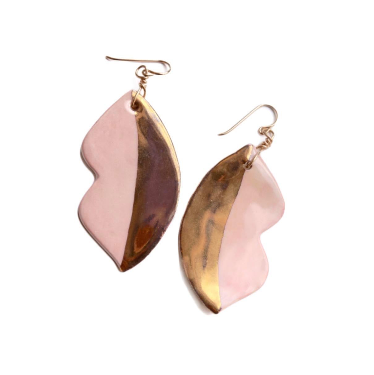 Handcrafted earrings in porcelain, painted in our 
bright custom made glaze and 14k gold leaf. Hypoallergenic gold-filled ear wire.  Each piece is hand made so slightly different from each other which gives our jewelry its unique look. Sold as a