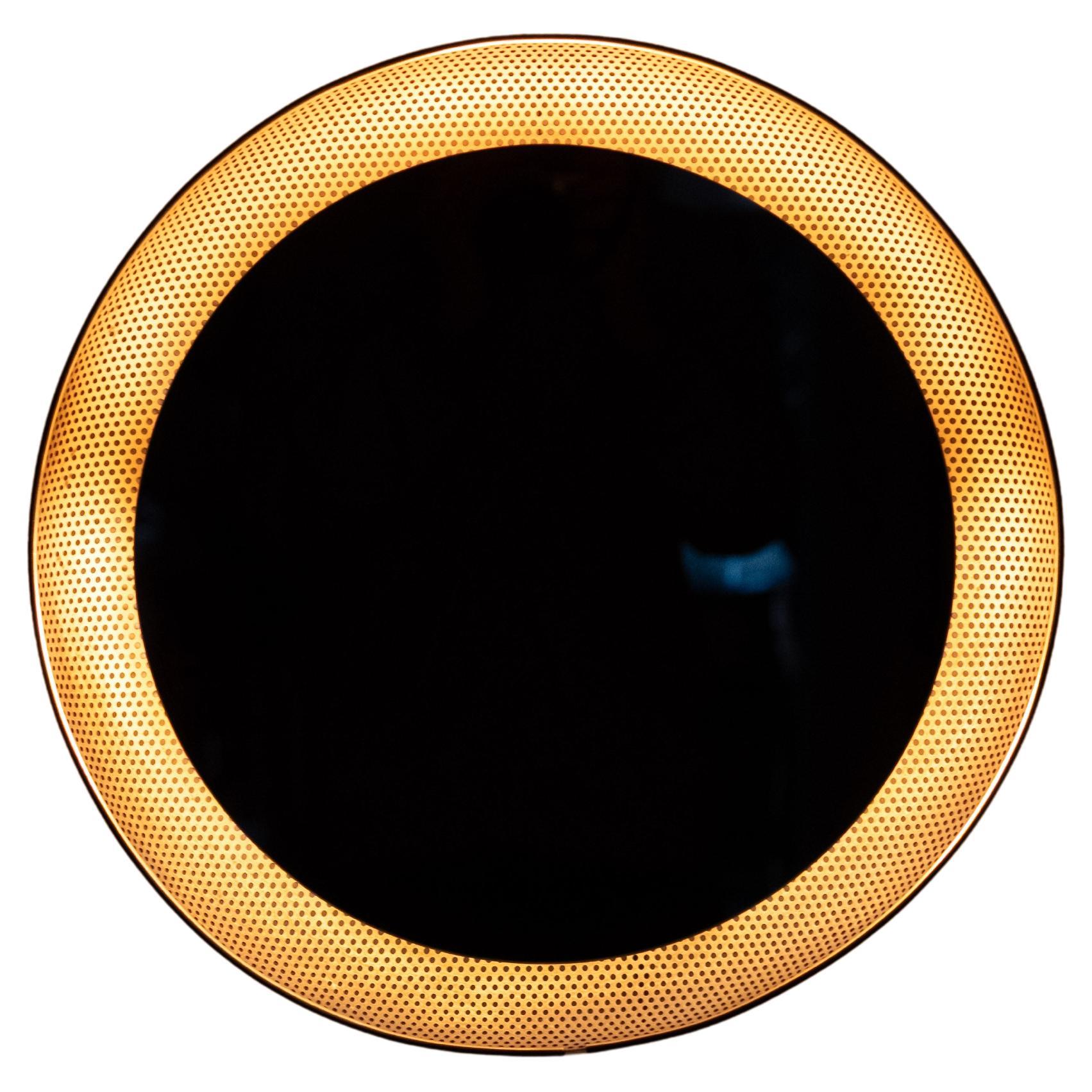 Mid-Century back lid Mirror by Mathieu Matégot for Artimeta, 1950s
Gold color perforated round Metal base .comes with a brand new Mirror .
Pull down switch . 3 small socket bulbs needed . 
Great looking mirror  .
  please ask for cheaper chipping