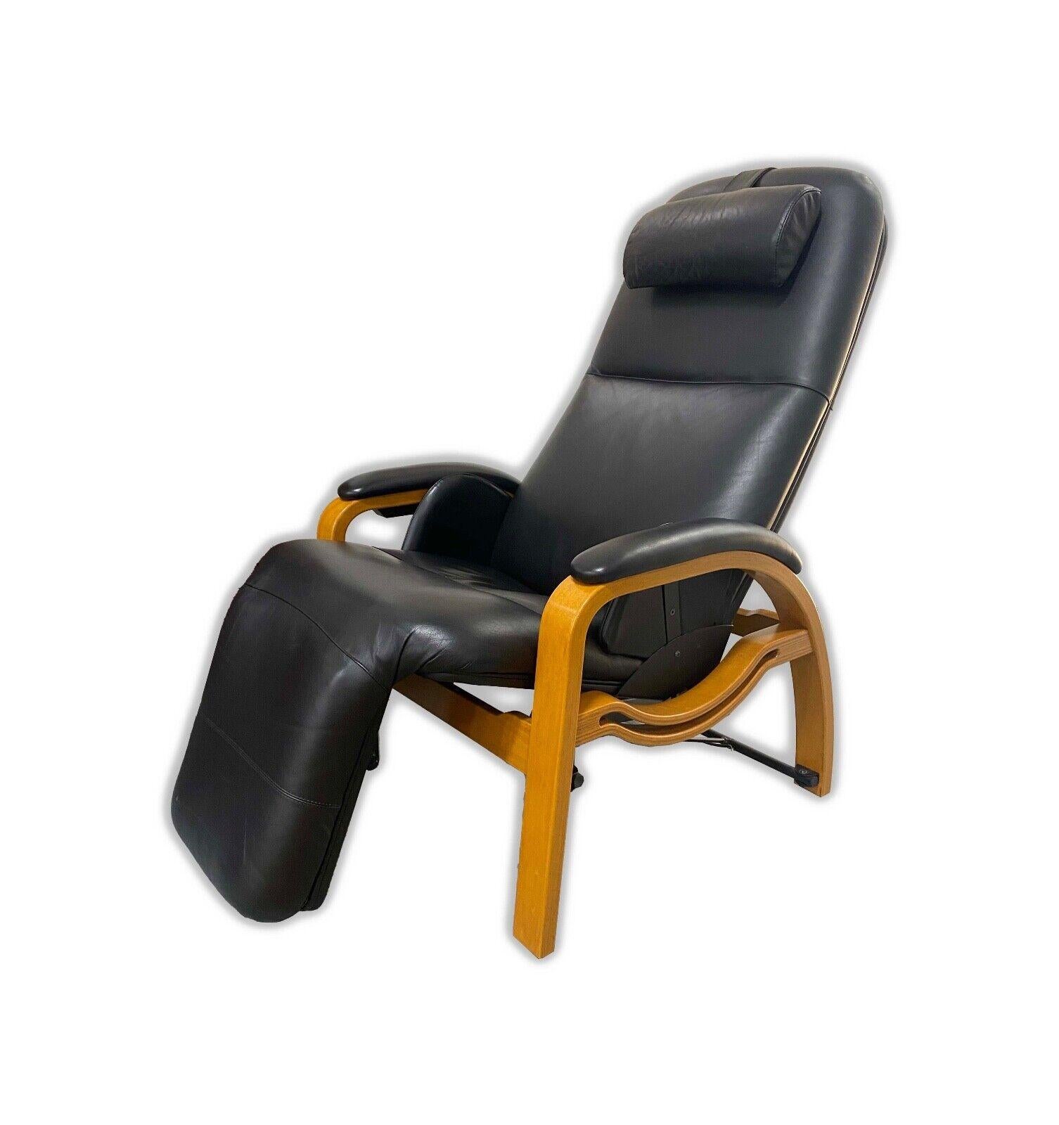 The Back Saver Zero Gravity Massage Chair is an embodiment of comfort and modern design, featuring a sleek mid-century modern style. It is upholstered in luxurious black leather, complemented by smooth, curved wooden accents that add a touch of
