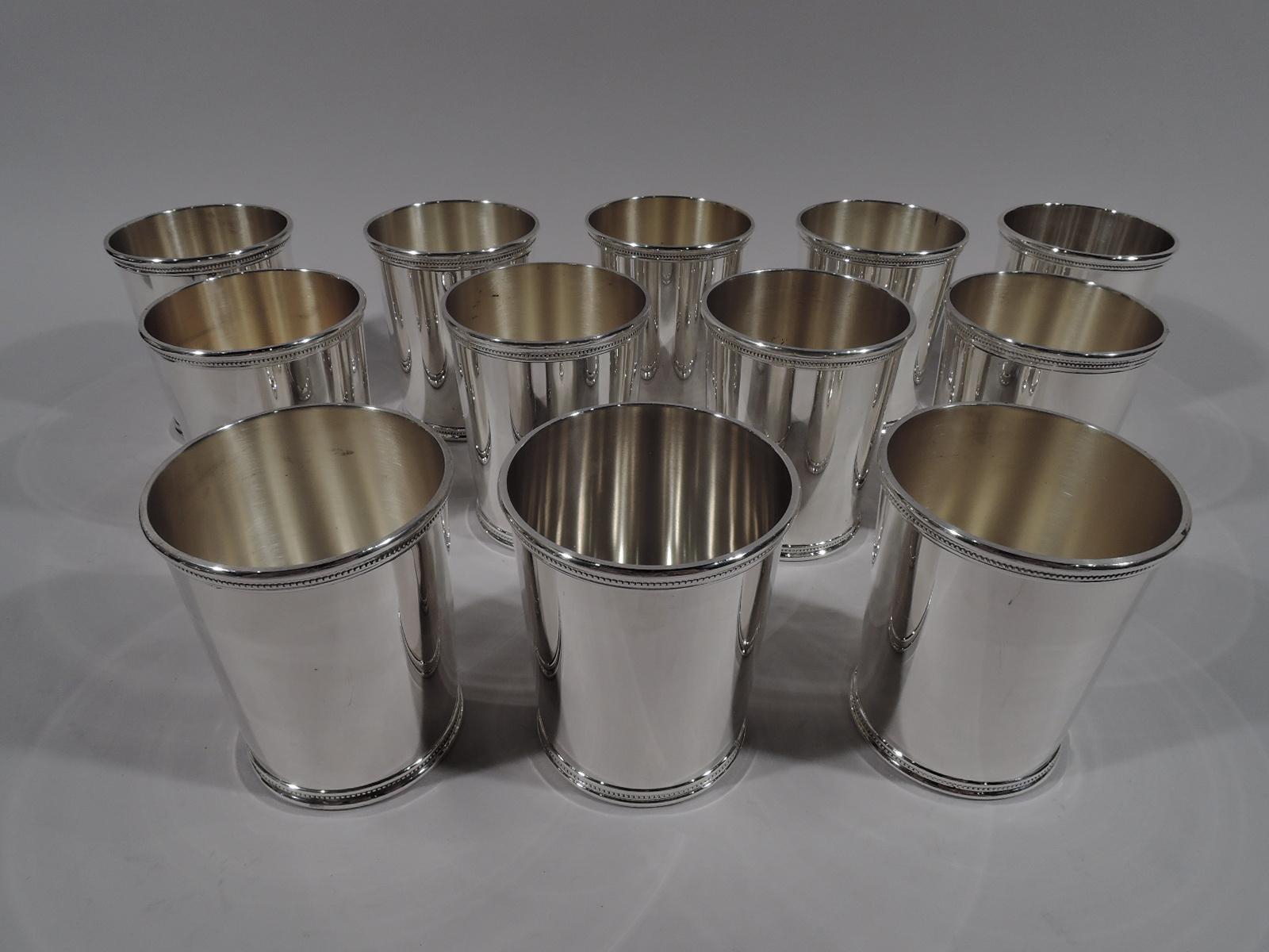 Back to the 1960s with a set of 12 LBJ-era sterling silver mint julep cups. Made by Mark J. Scearce in Shelbyville, Kentucky. Each: Straight and tapering sides with beaded rims. Fully marked including presidential date stamp for Lyndon Baines